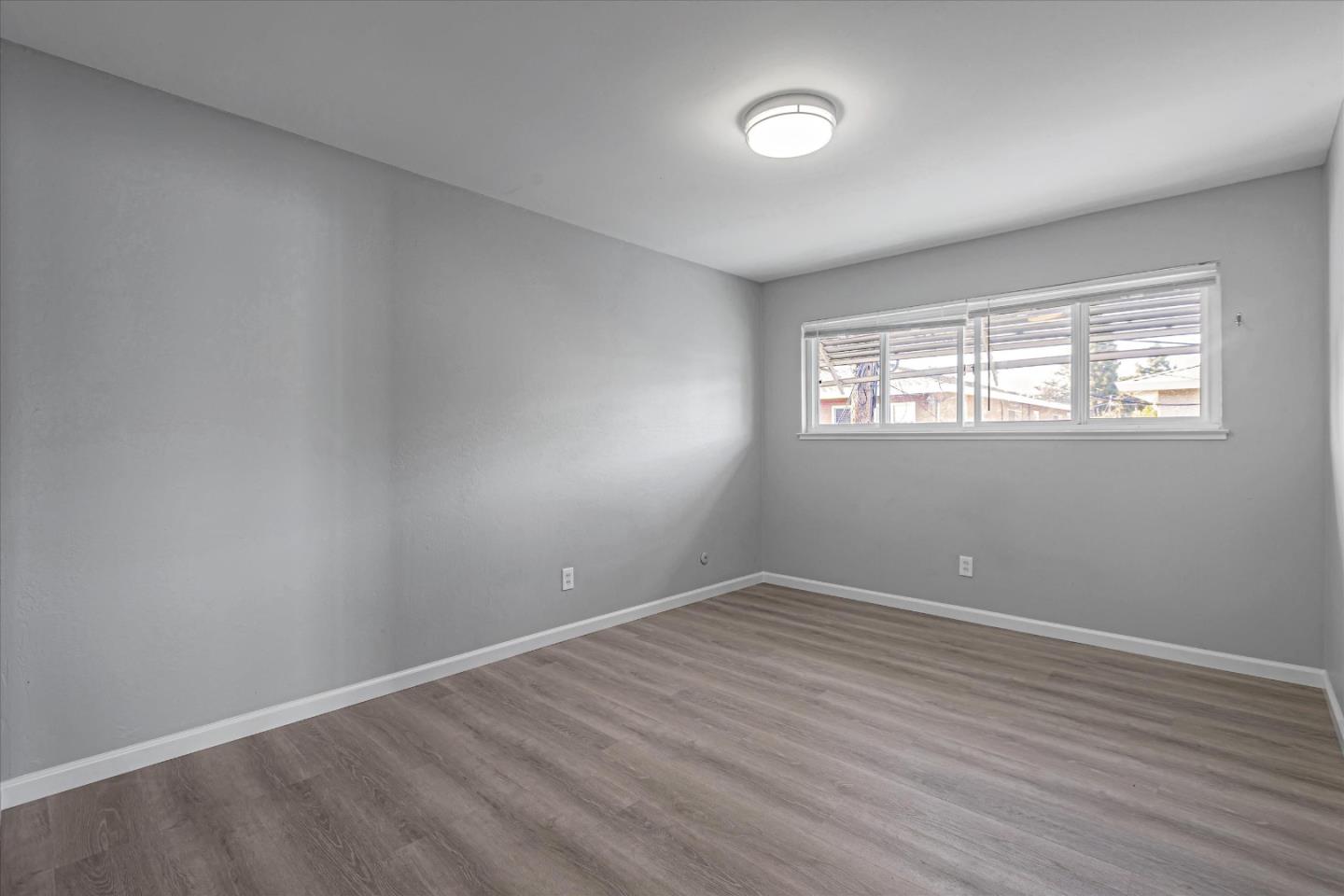 477 Greendale Way San Jose, CA 95129 - Photo 23 of 33 wooden floor in an empty room with a window