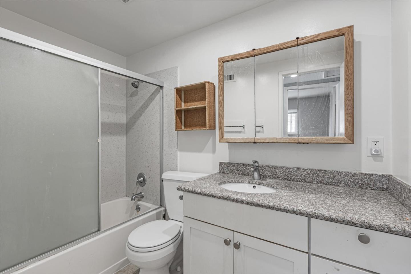 477 Greendale Way San Jose, CA 95129 - Photo 30 of 33 a bathroom with a granite countertop sink a toilet and a mirror