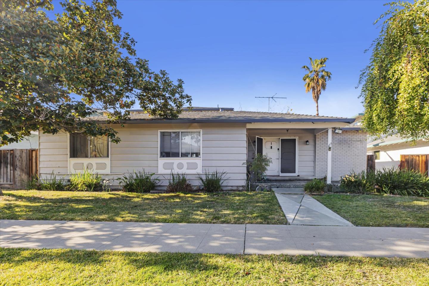 477 Greendale Way San Jose, CA 95129 - Photo 4 of 33 a view of a house with a yard