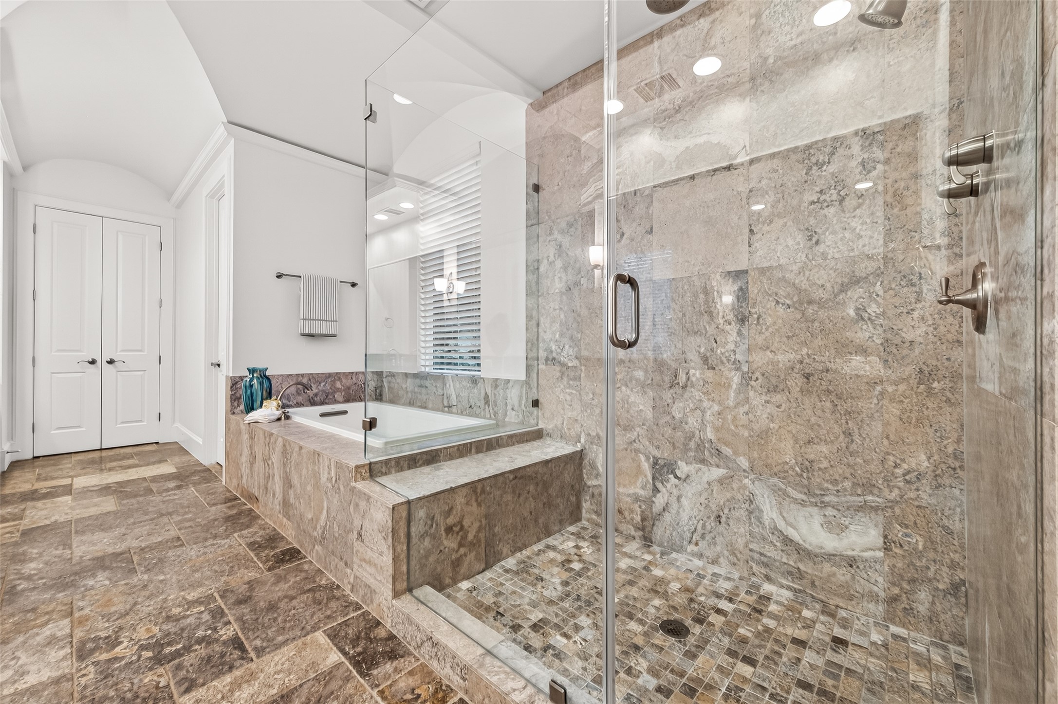1208 Welch Street Houston, TX 77006 - Photo 5 of 35 This spa-like bathroom has it all--huge frameless glass shower with seat, wall-mounted shower head and ceiling-mounted rain head, soaking tub, double vanities, and large walk-in closet.