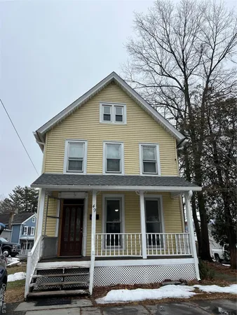 a view of a house with large windows