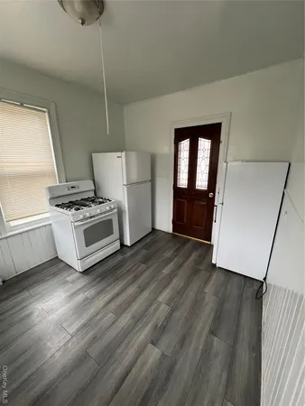 a view of kitchen and wooden floor