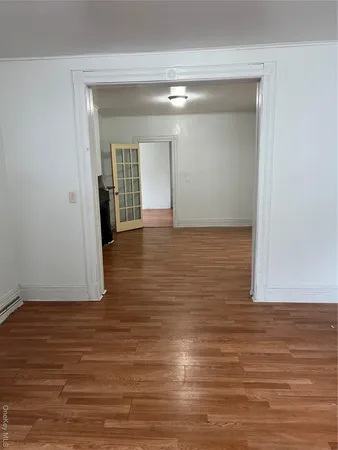 a view of hallway with wooden floor