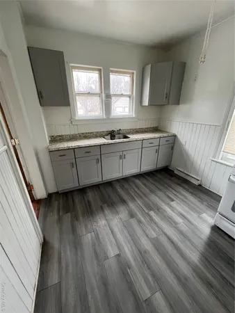 a room with window and wooden floor