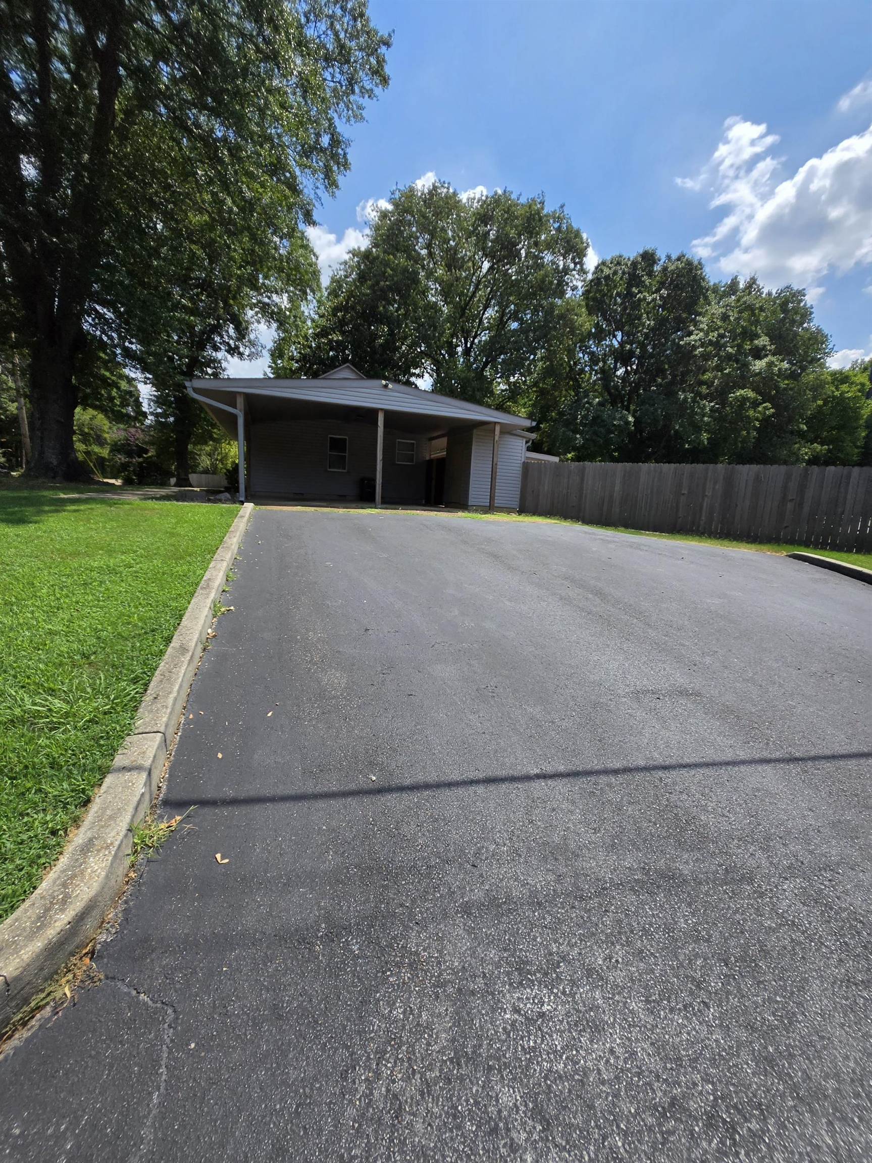 6871 Raleigh Lagrange Road Memphis, TN 38134 - Photo 2 of 8 a front view of a house with a yard