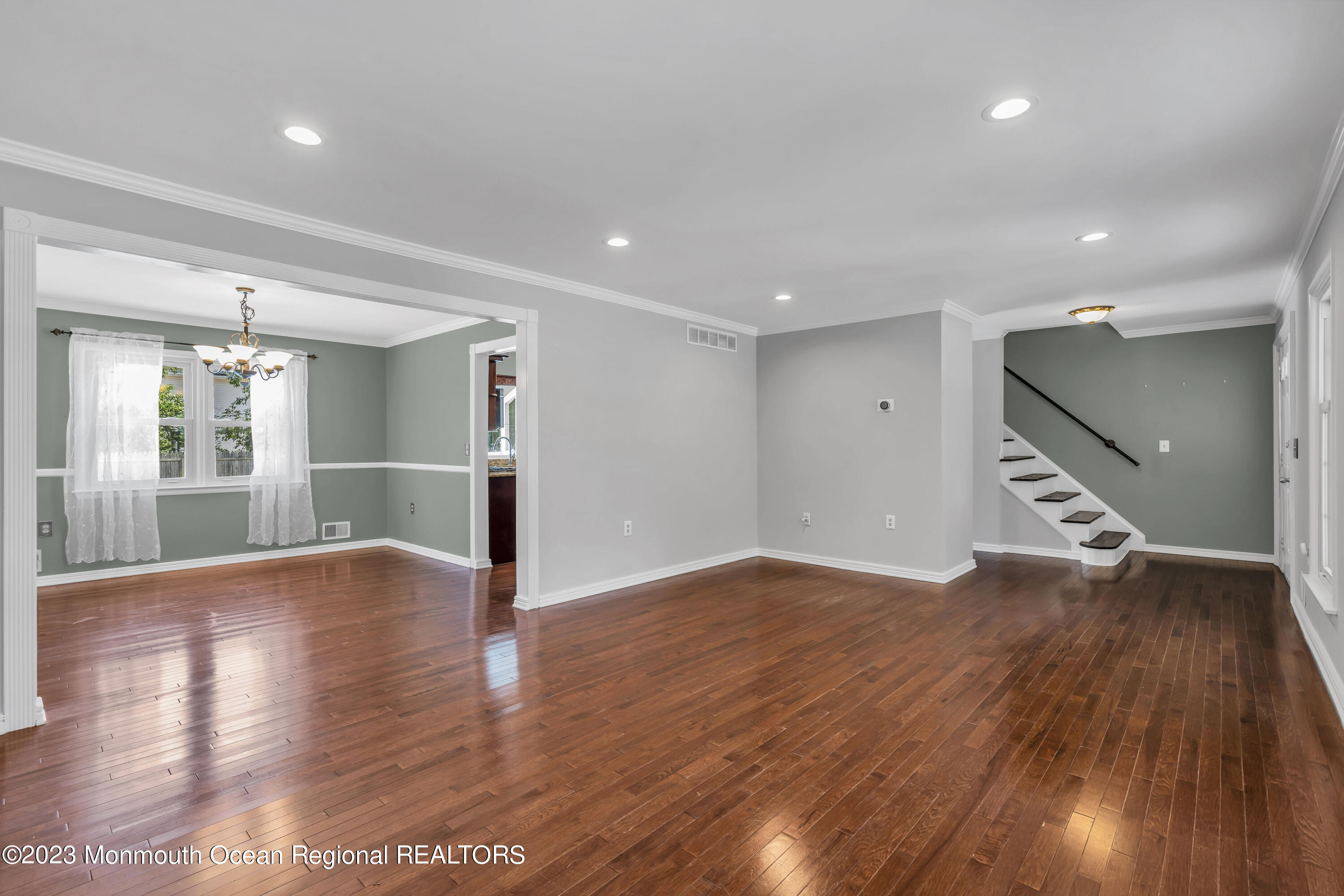 19 Poplar Street Howell, NJ 07731 - Photo 12 of 62 a view of an empty room with wooden floor kitchen view and a window