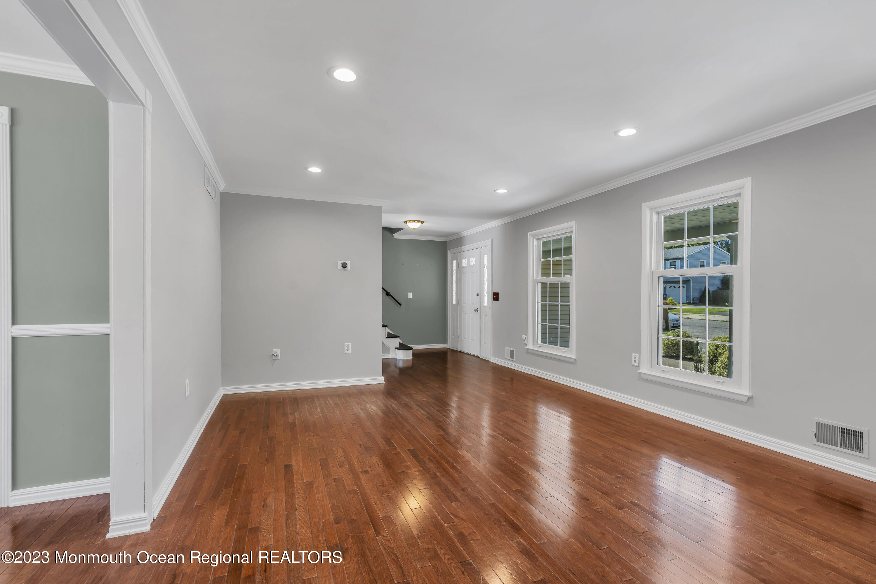 19 Poplar Street Howell, NJ 07731 - Photo 13 of 62 a view of an empty room with wooden floor and a window