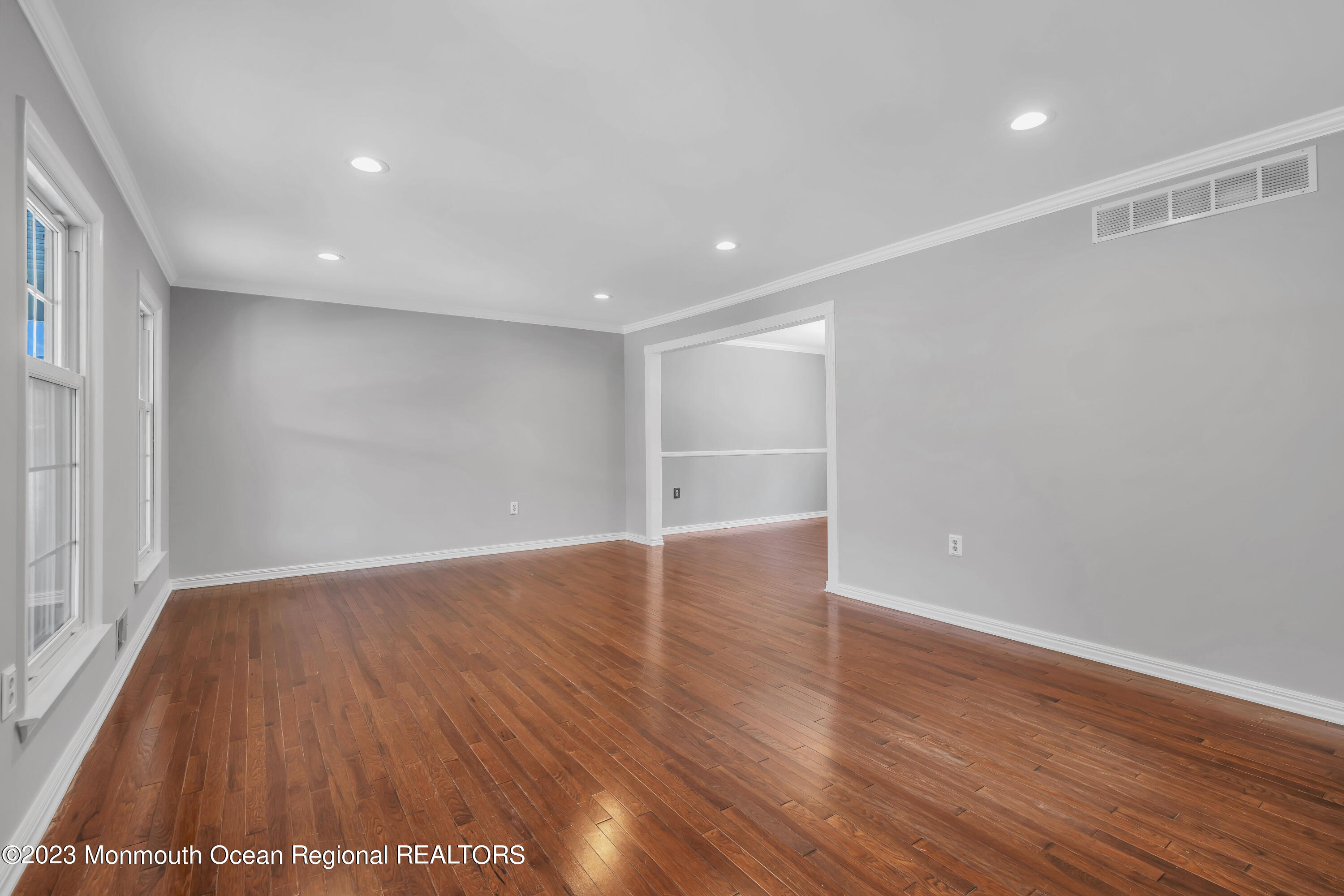 19 Poplar Street Howell, NJ 07731 - Photo 14 of 62 a view of an empty room with wooden floor and a window