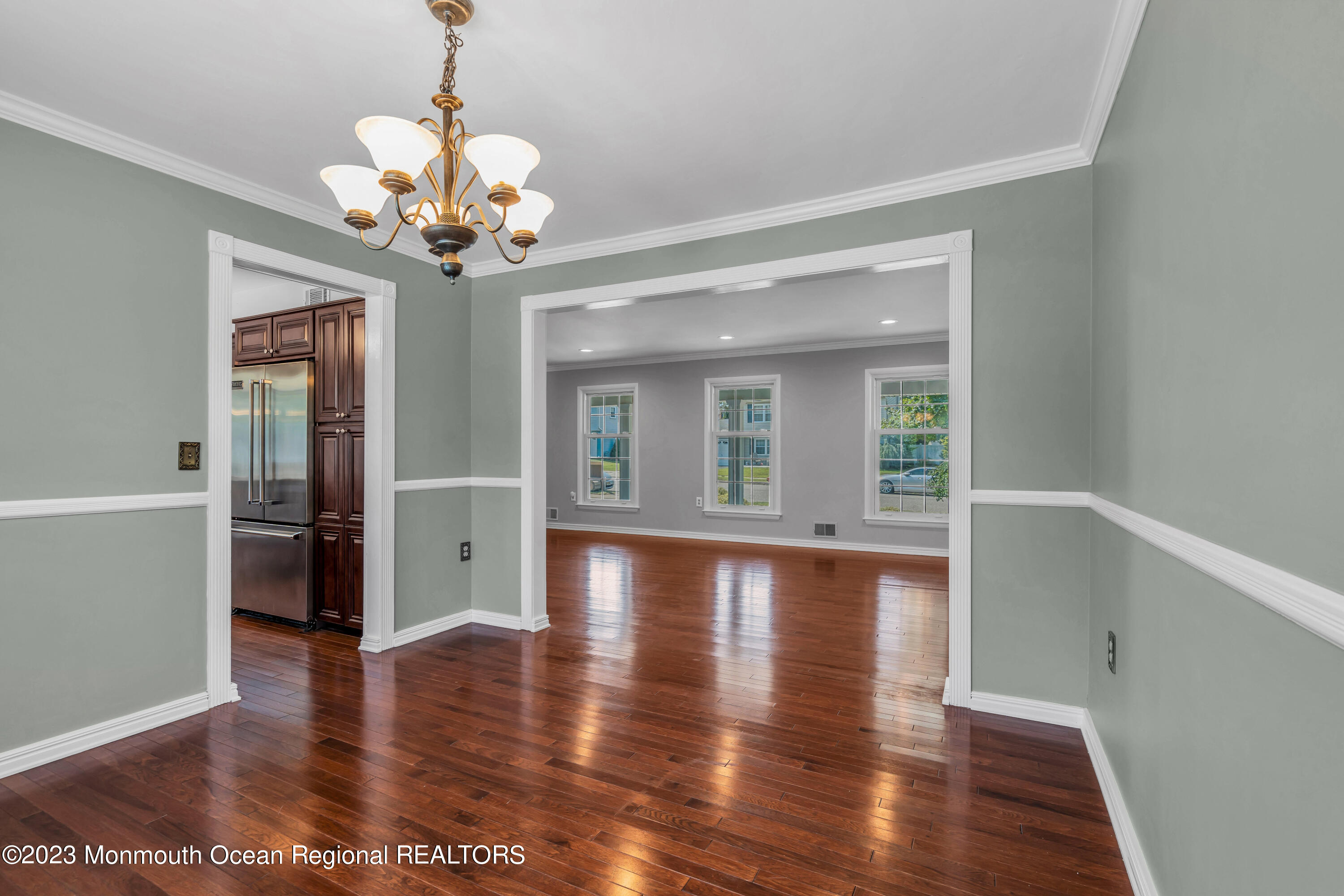 19 Poplar Street Howell, NJ 07731 - Photo 15 of 62 a view of a room with wooden floor and chandelier