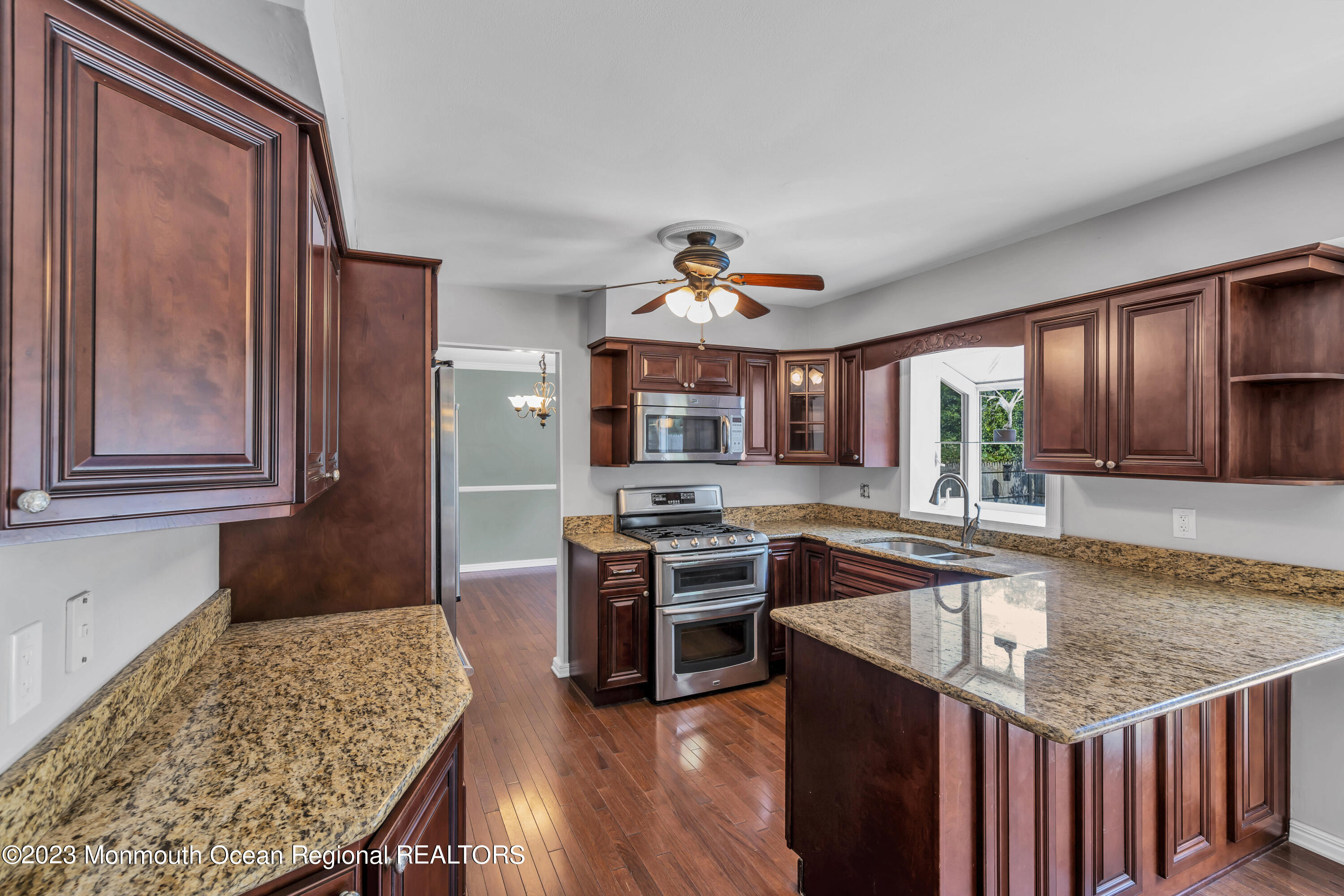 19 Poplar Street Howell, NJ 07731 - Photo 17 of 62 a kitchen with stainless steel appliances granite countertop a stove and a sink