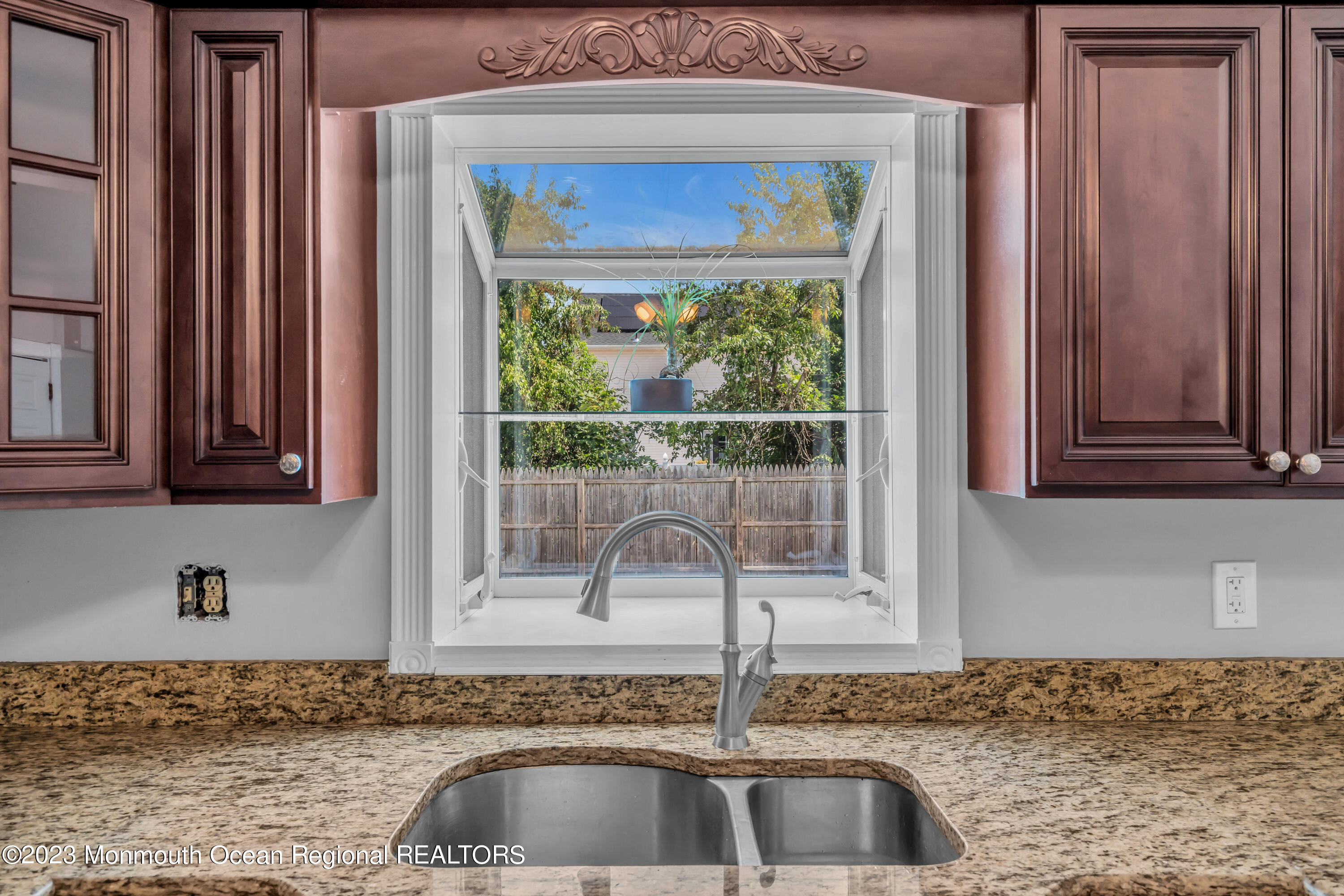 19 Poplar Street Howell, NJ 07731 - Photo 19 of 62 a kitchen with granite countertop a sink and a window
