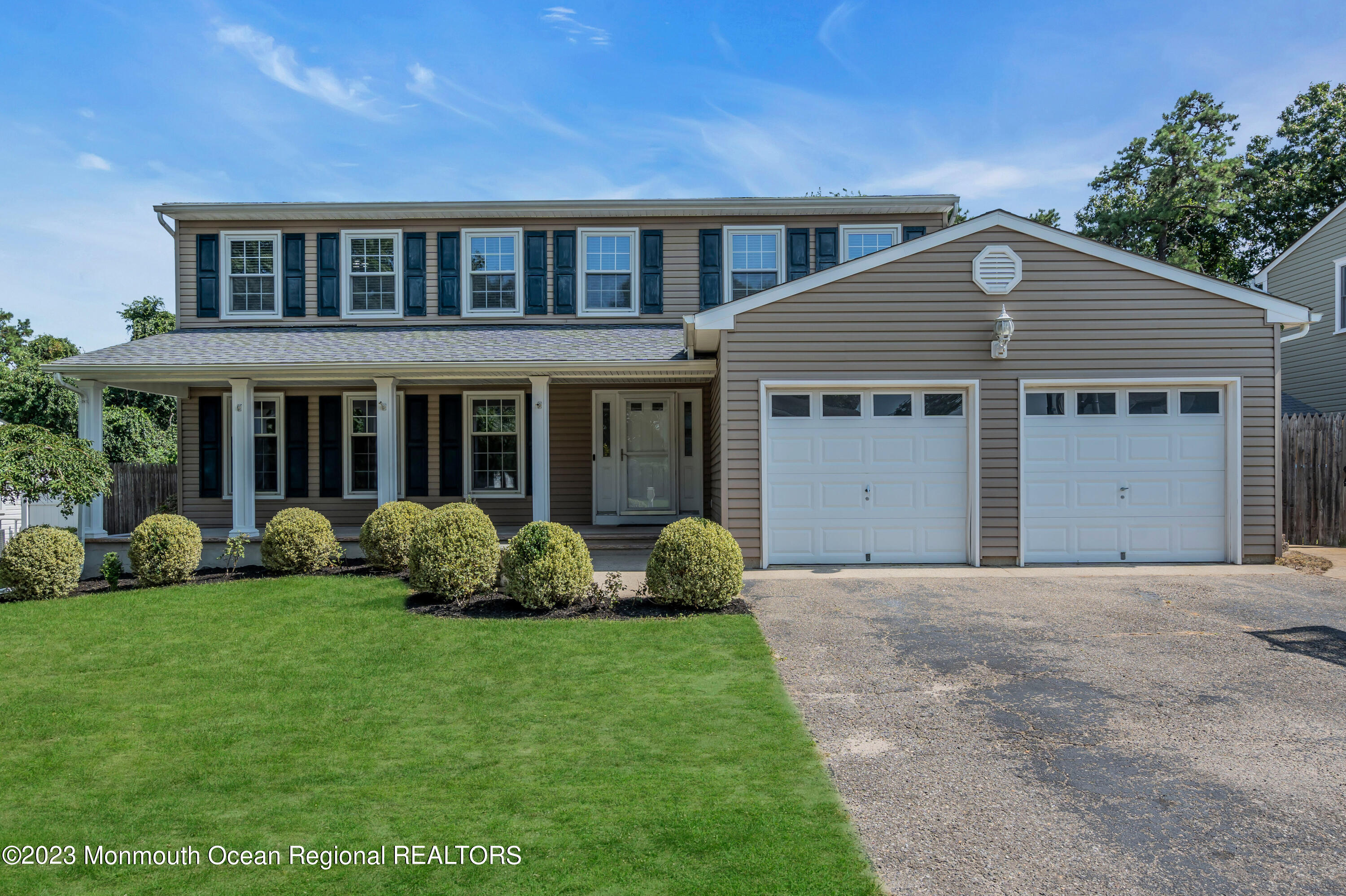 19 Poplar Street Howell, NJ 07731 - Photo 2 of 62 a front view of a house with a garden