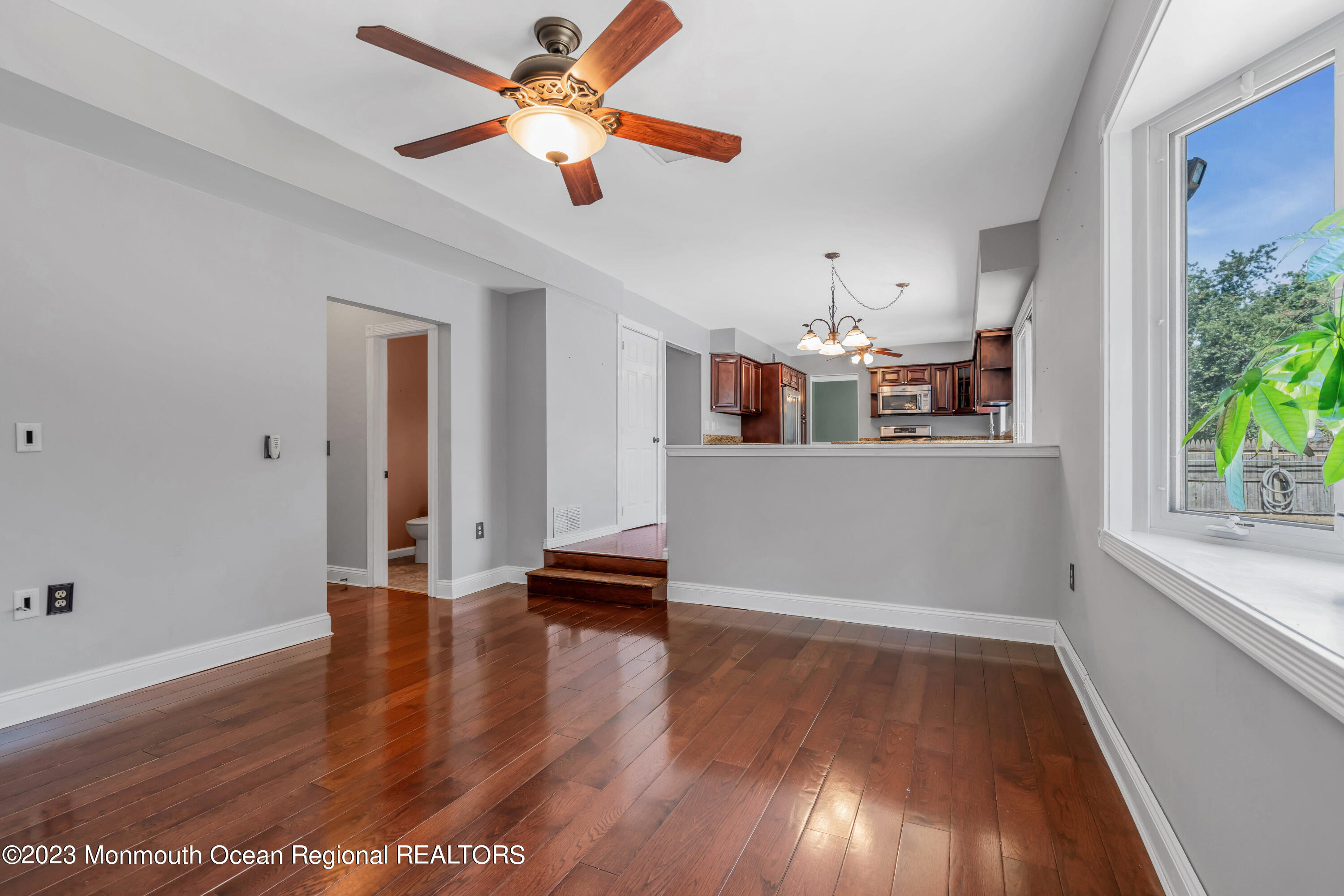 19 Poplar Street Howell, NJ 07731 - Photo 28 of 62 an empty room with wooden floor and windows
