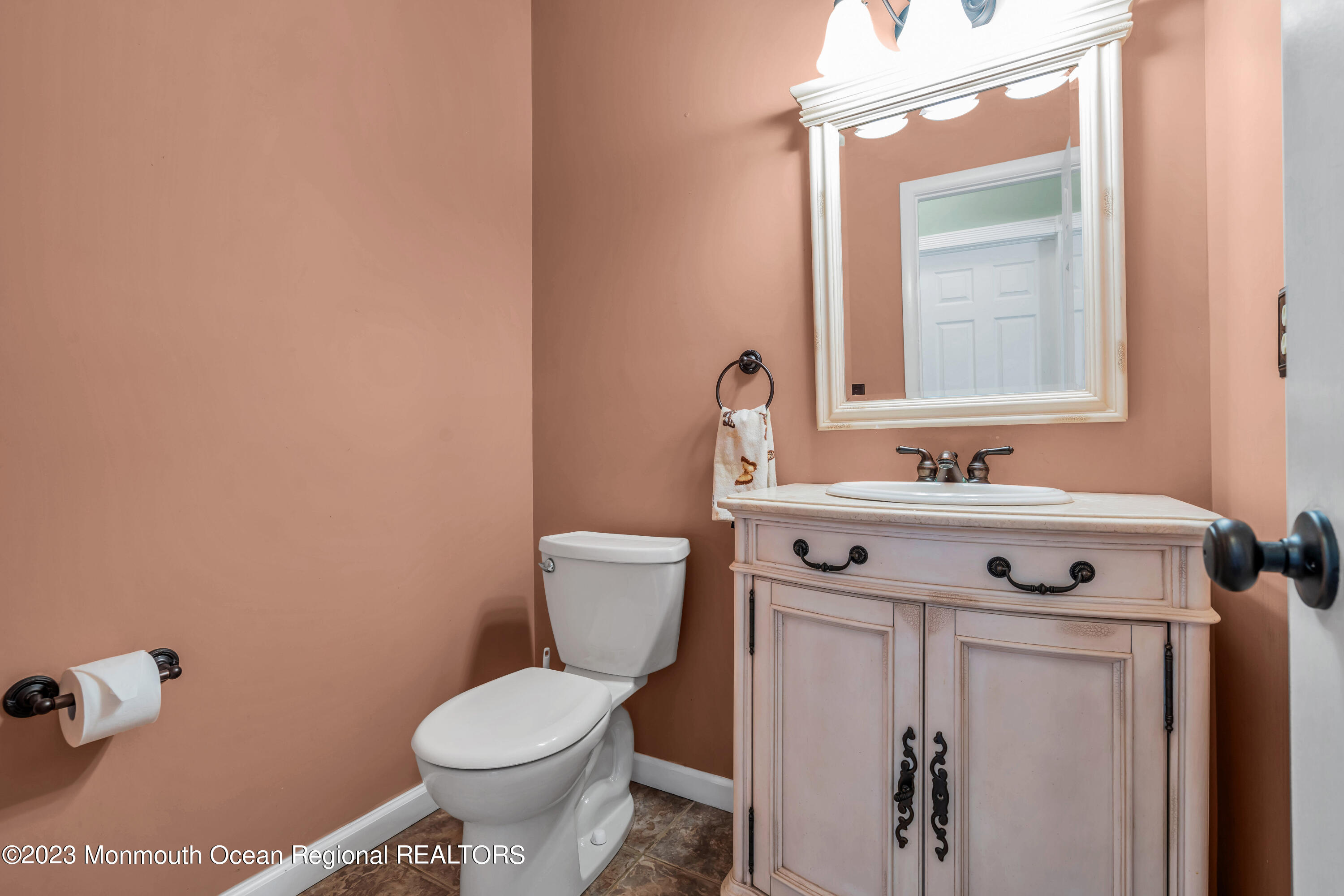 19 Poplar Street Howell, NJ 07731 - Photo 30 of 62 a bathroom with a sink toilet and mirror