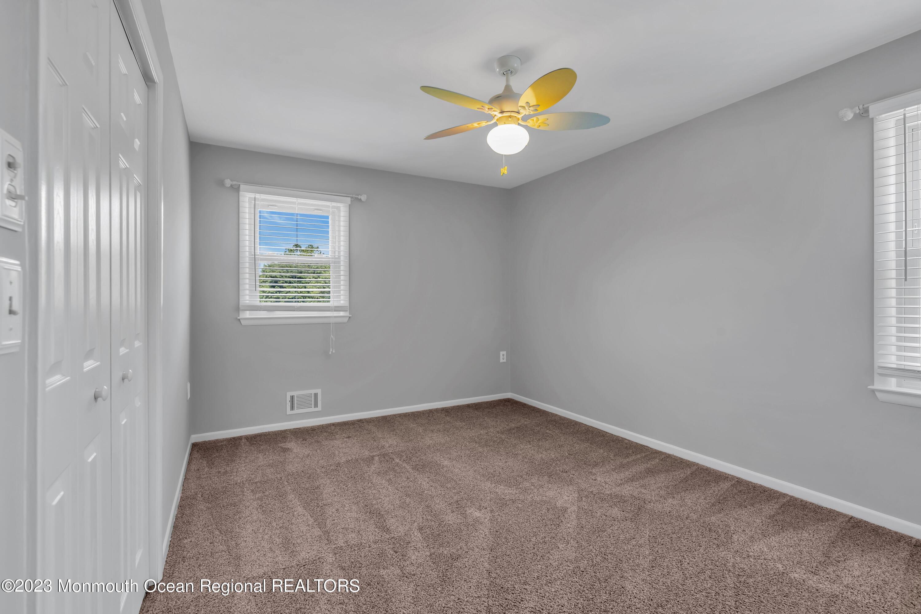 19 Poplar Street Howell, NJ 07731 - Photo 32 of 62 an empty room with a window and wooden floor