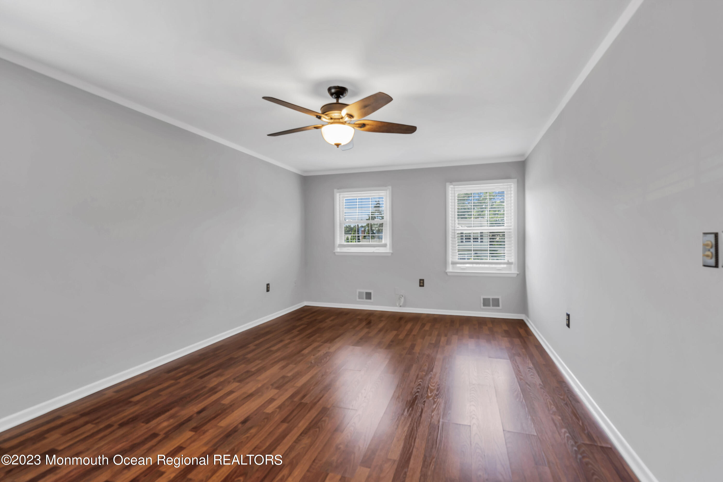 19 Poplar Street Howell, NJ 07731 - Photo 41 of 62 a view of empty room with wooden floor and fan
