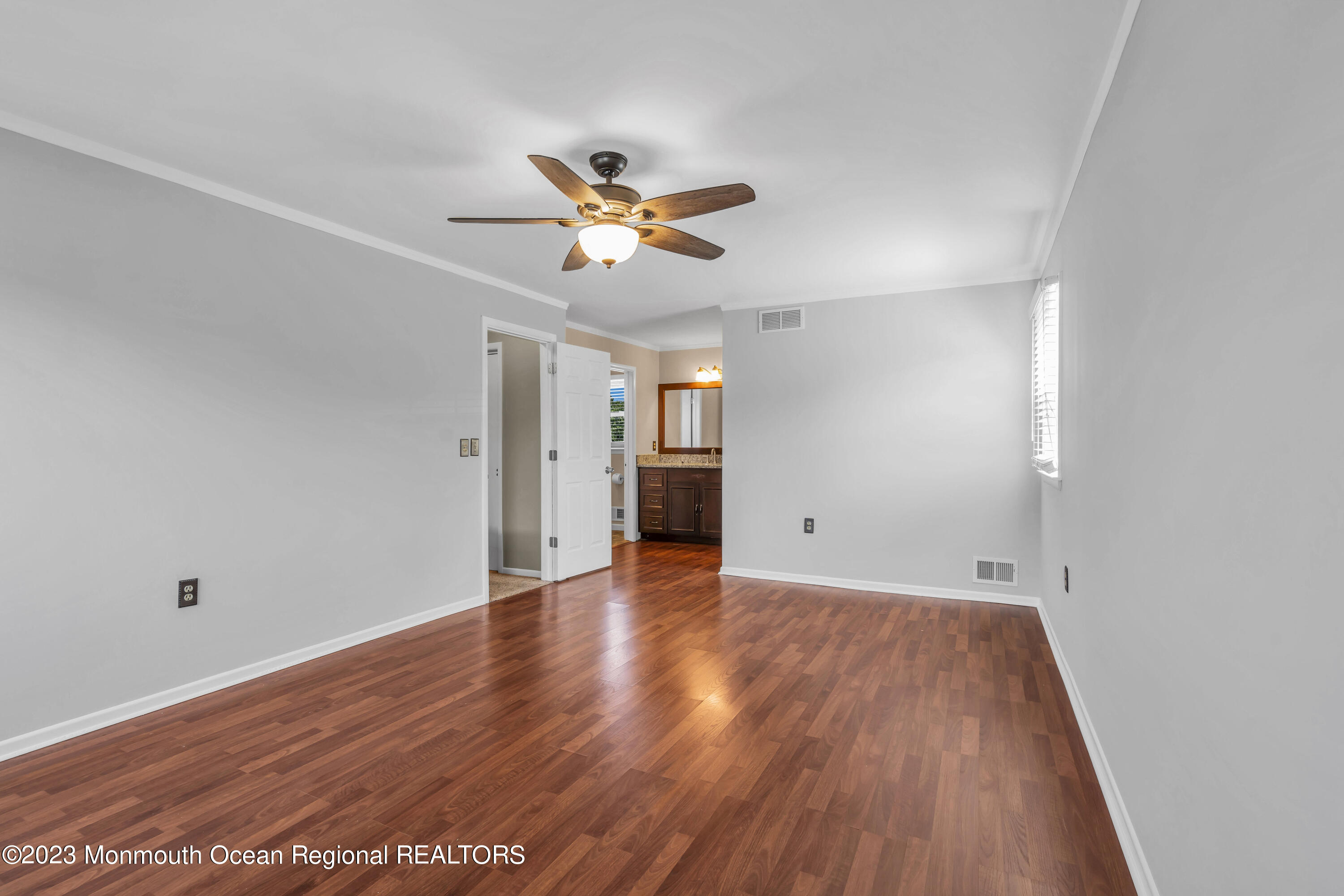 19 Poplar Street Howell, NJ 07731 - Photo 43 of 62 a view of empty room with wooden floor and ceiling fan