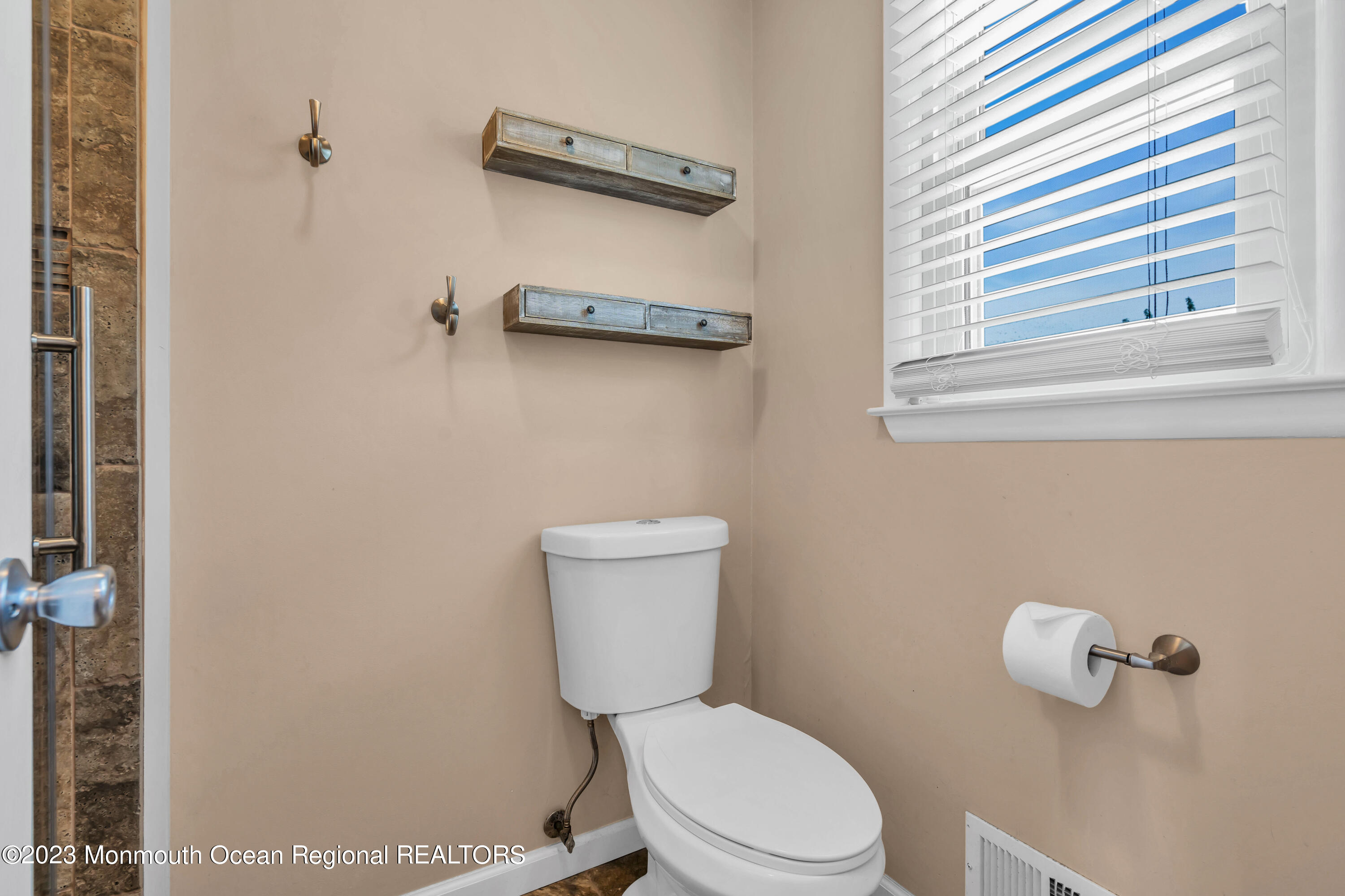 19 Poplar Street Howell, NJ 07731 - Photo 46 of 62 a white toilet sitting next to a bathroom sink