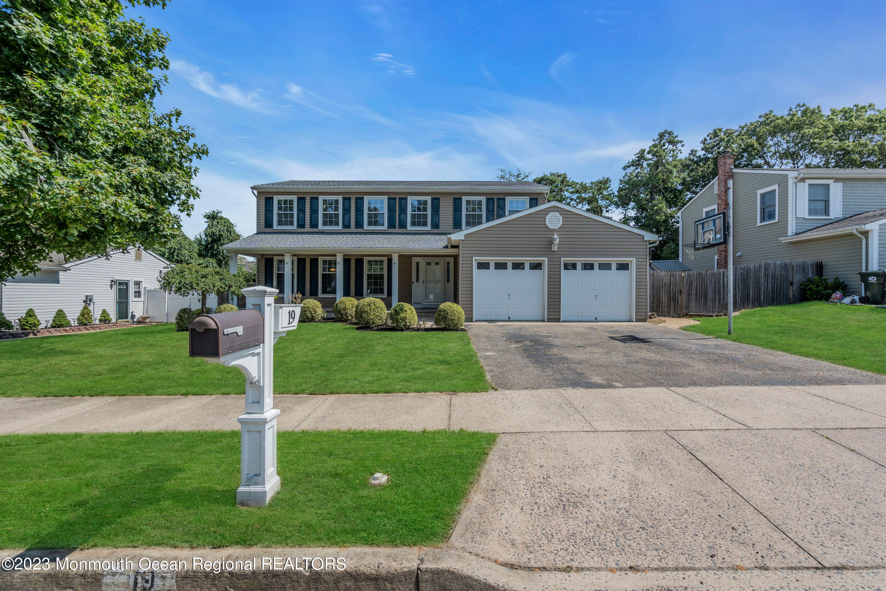 19 Poplar Street Howell, NJ 07731 - Photo 5 of 62 a front view of a house with a yard