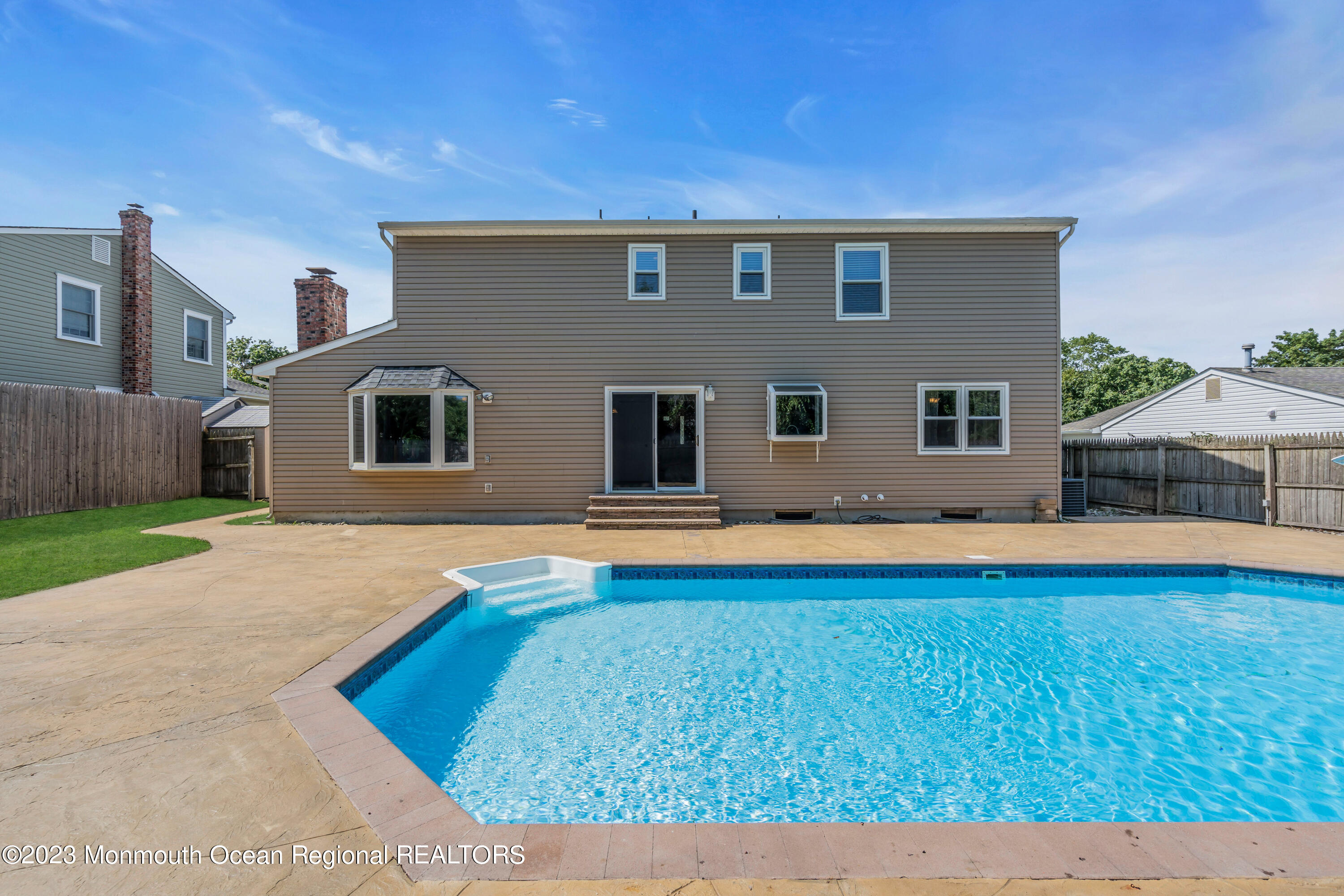 19 Poplar Street Howell, NJ 07731 - Photo 54 of 62 a house view with swimming pool in front of it