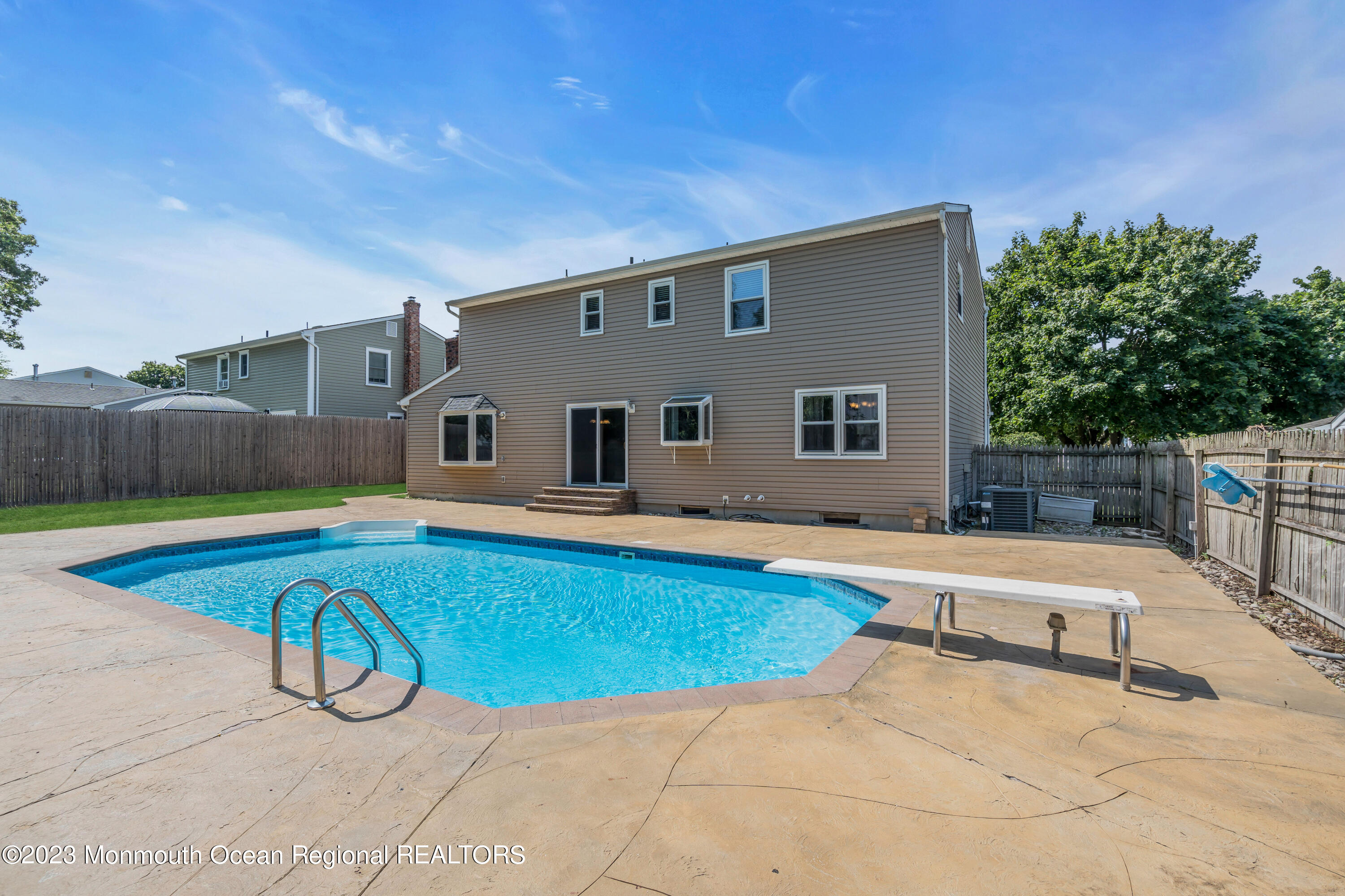 19 Poplar Street Howell, NJ 07731 - Photo 56 of 62 a swimming pool with yard and outdoor seating