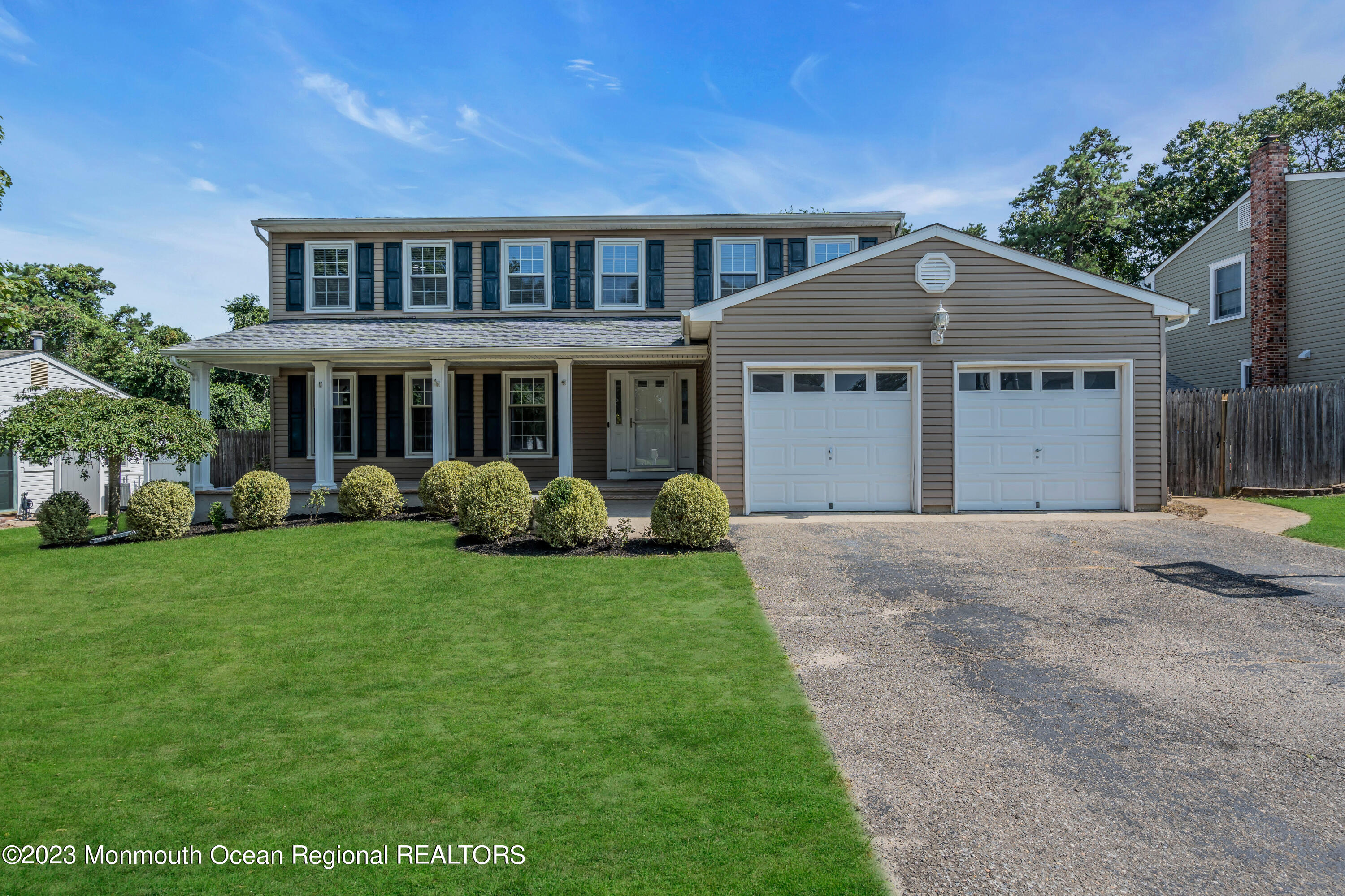 19 Poplar Street Howell, NJ 07731 - Photo 6 of 62 a front view of a house with a yard and garage