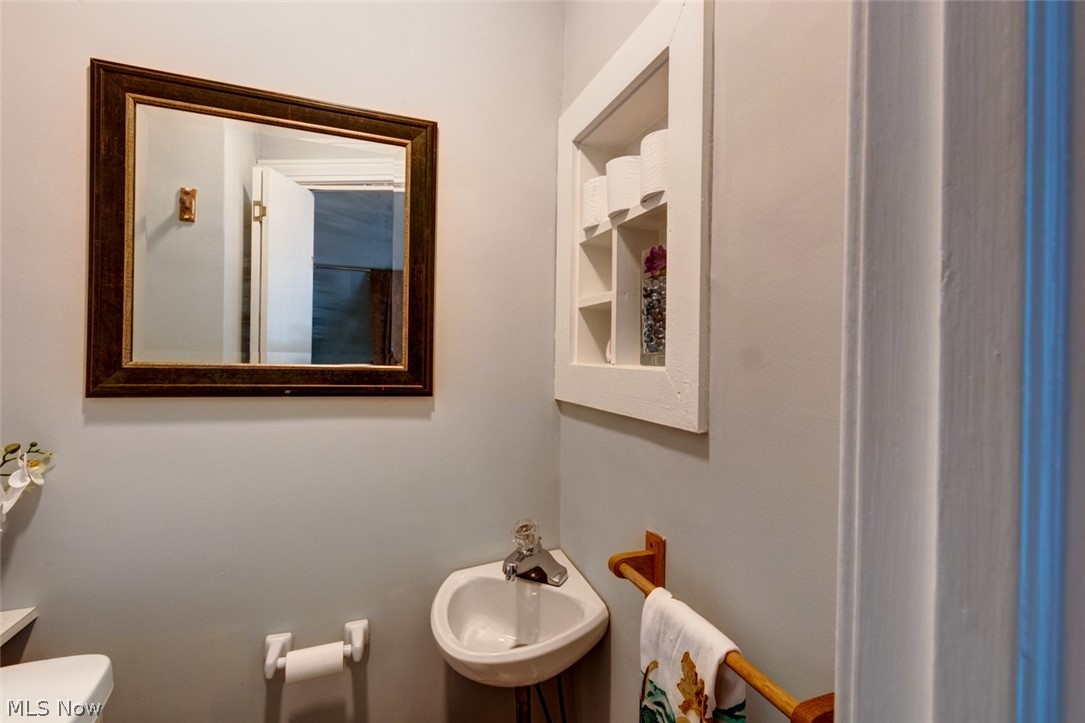 1600 Holmden Road Cleveland, OH 44121 - Photo 10 of 26 Powder room is convenient to the main level, perfect for guests!