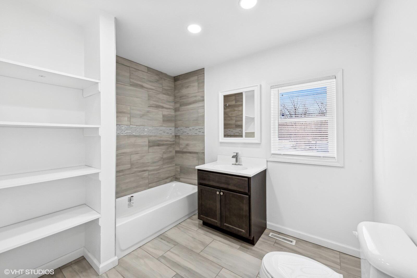1025 Wallace Street Gary, IN 46404 - Photo 8 of 19 a bathroom with a sink toilet and bathtub