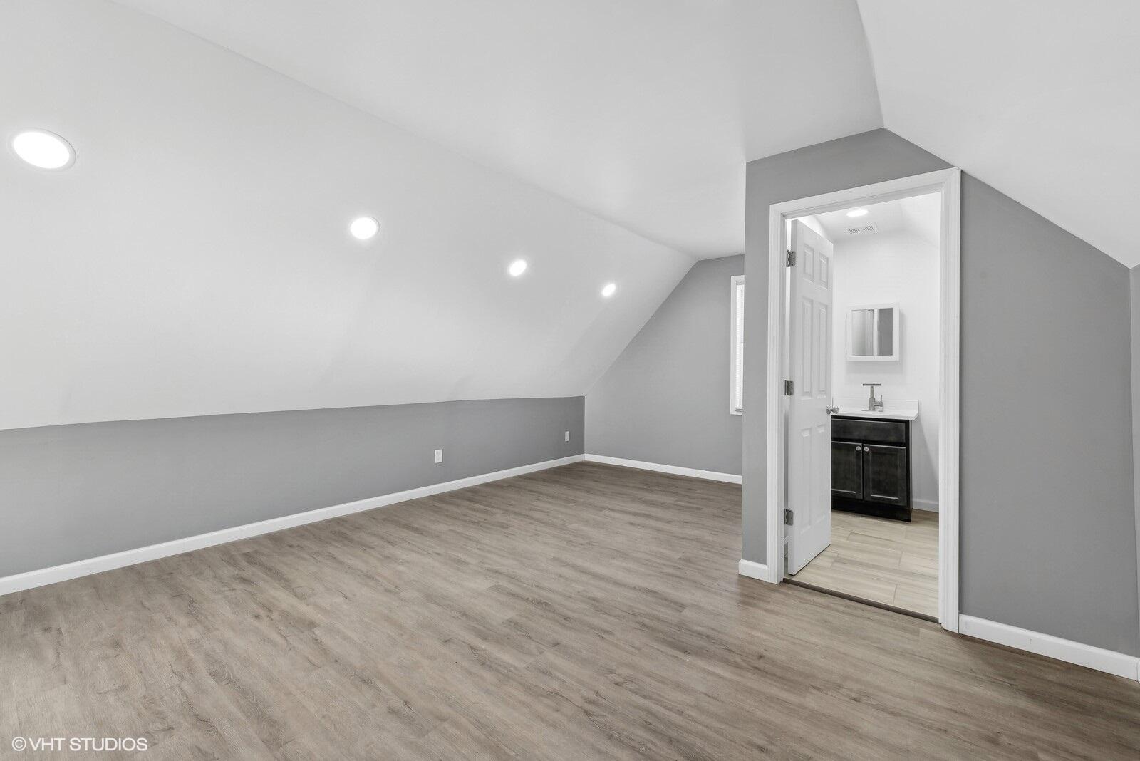 1025 Wallace Street Gary, IN 46404 - Photo 10 of 19 an empty room with wooden floor and entrance