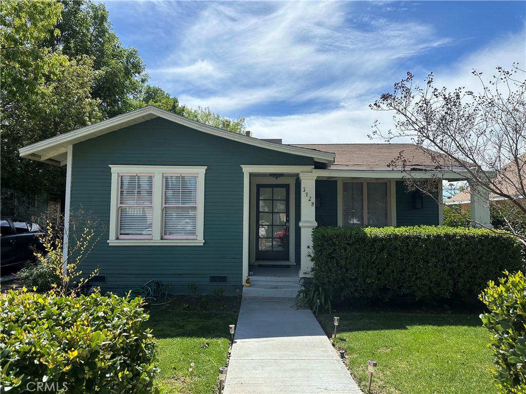 3728 Briscoe Street Riverside, CA 92506 - Photo 1 of 1 a front view of a house with a yard