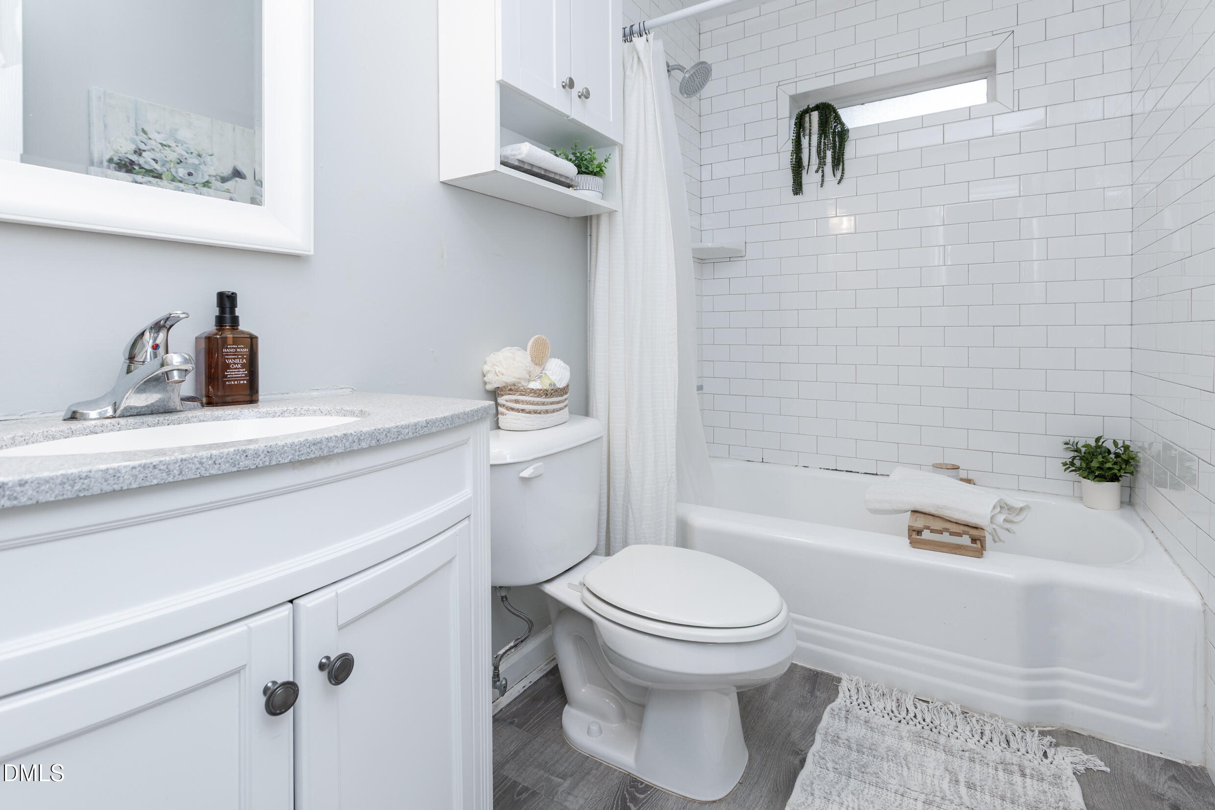 1206 Downing Road Raleigh, NC 27610 - Photo 12 of 13 a bathroom with a sink toilet and shower
