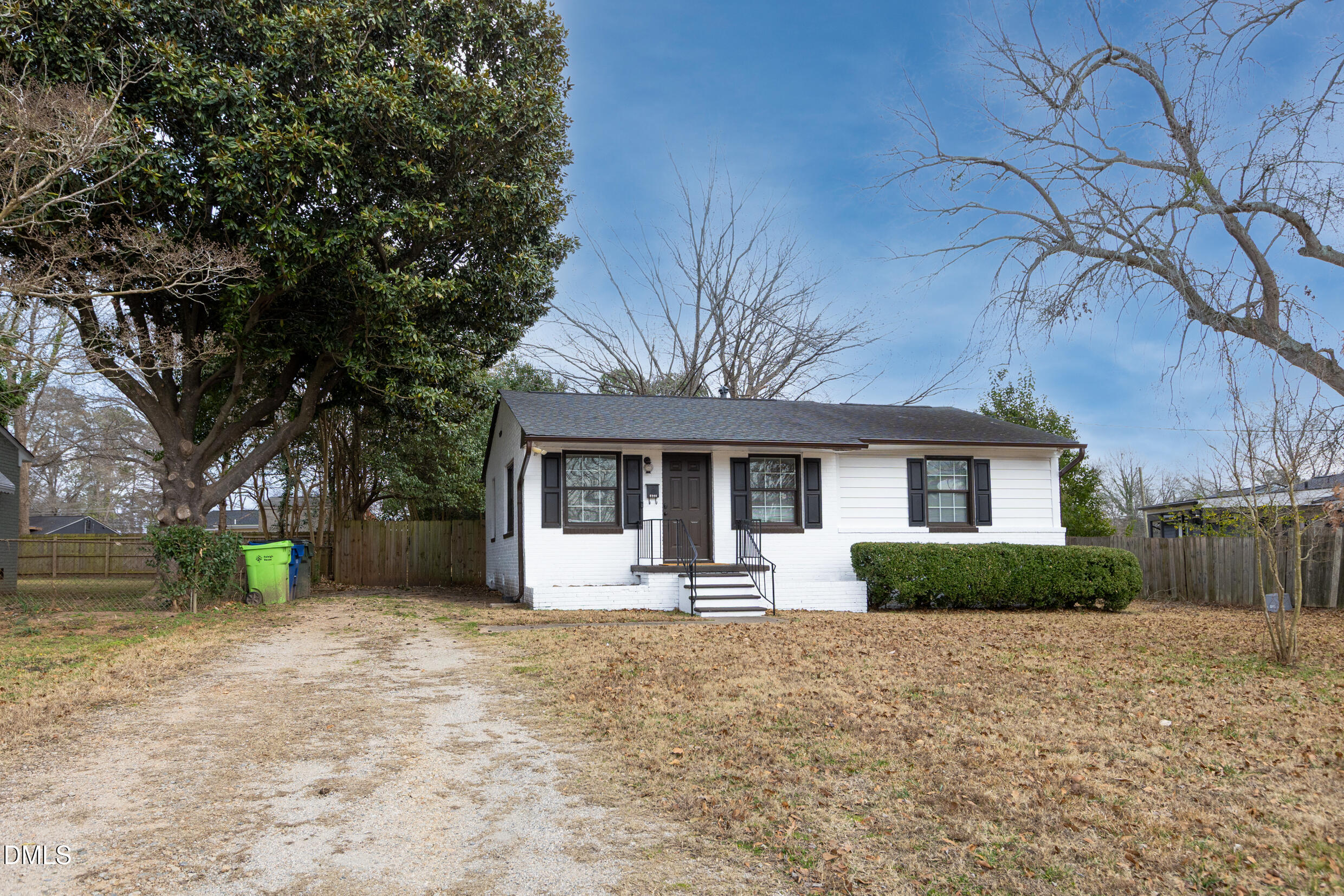 1206 Downing Road Raleigh, NC 27610 - Photo 13 of 13 a front view of a house with a yard and tree