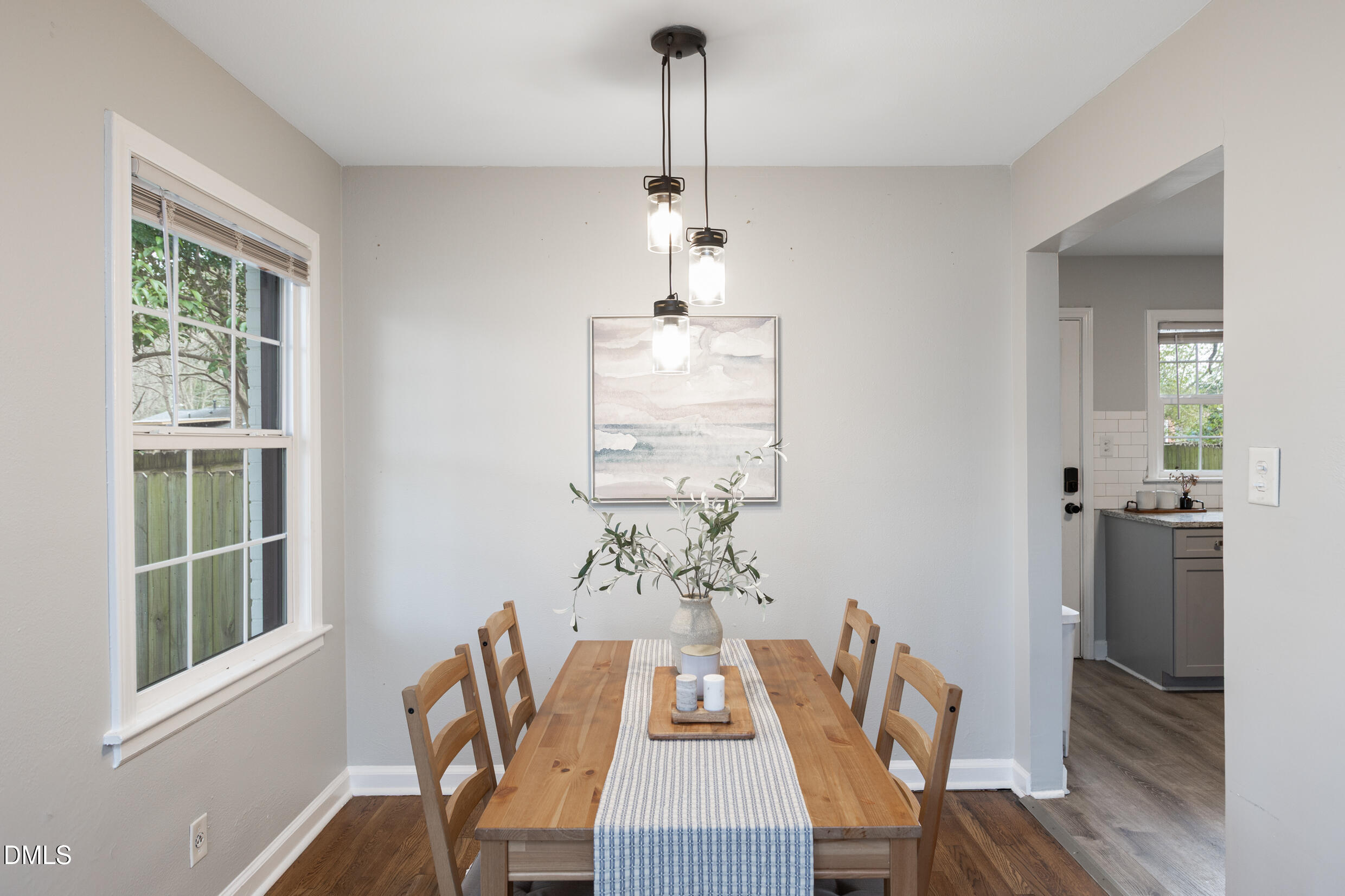1206 Downing Road Raleigh, NC 27610 - Photo 6 of 13 a view of a dining room with furniture window and wooden floor