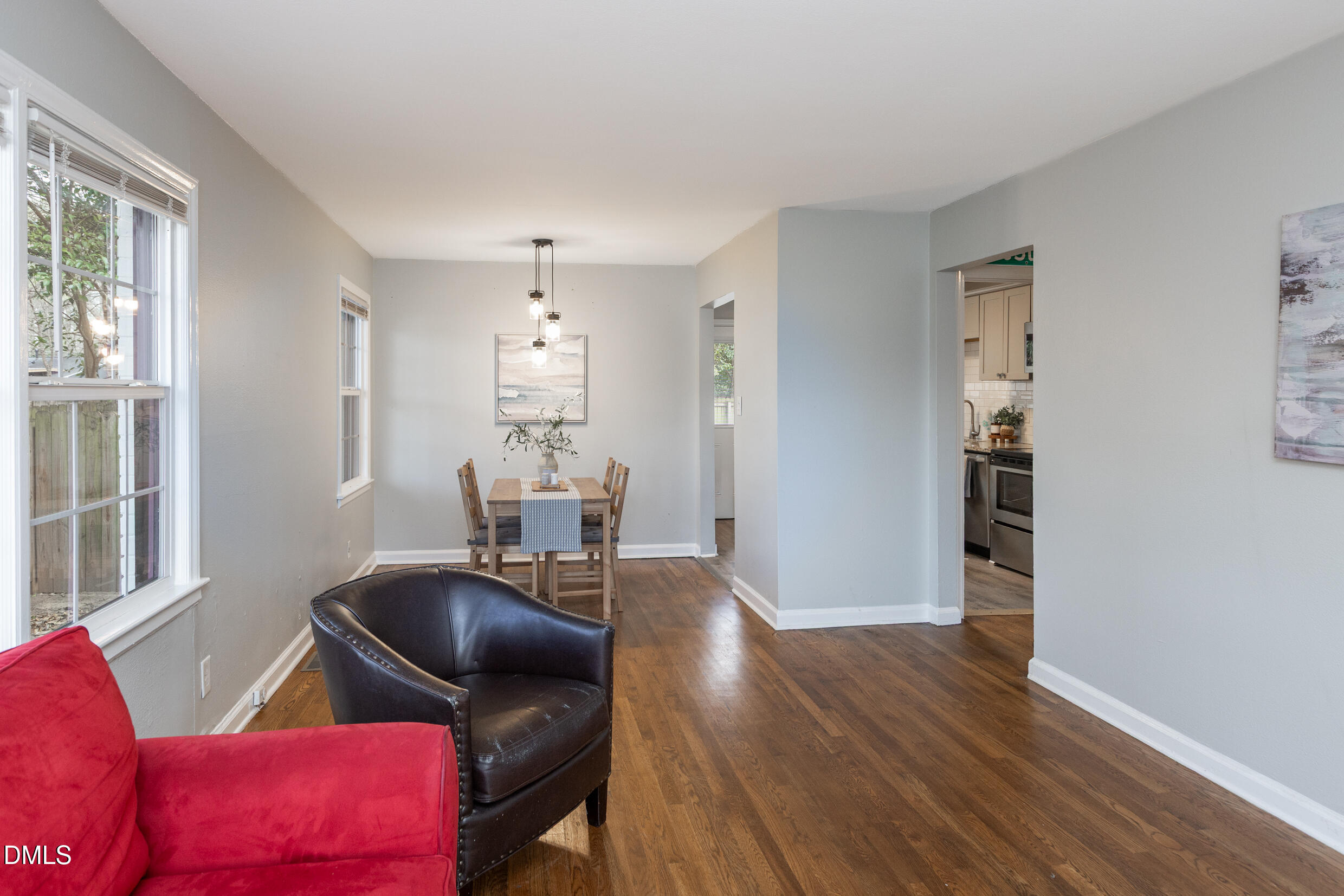 1206 Downing Road Raleigh, NC 27610 - Photo 7 of 13 a living room with furniture and wooden floor