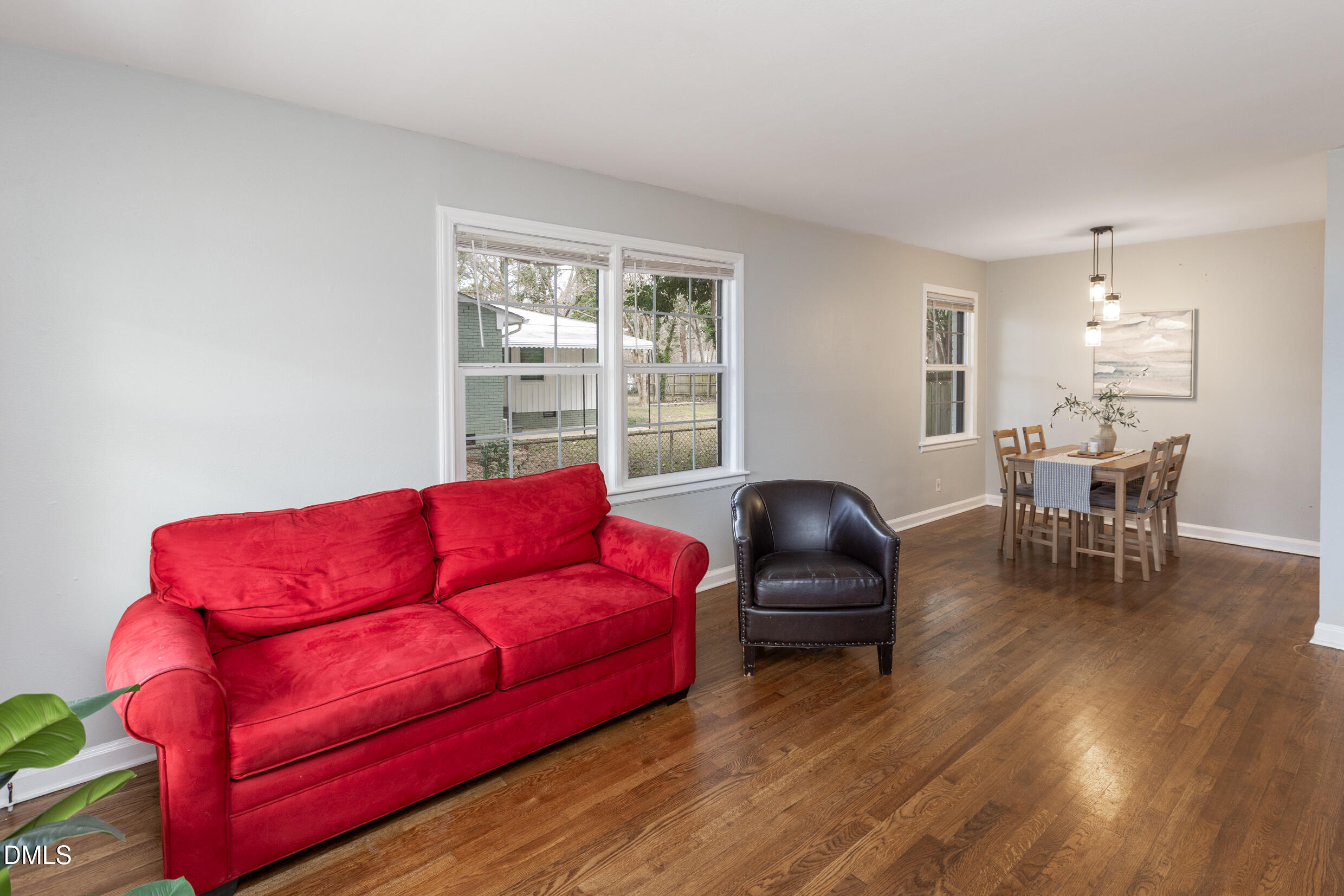 1206 Downing Road Raleigh, NC 27610 - Photo 9 of 13 a living room with furniture and wooden floor