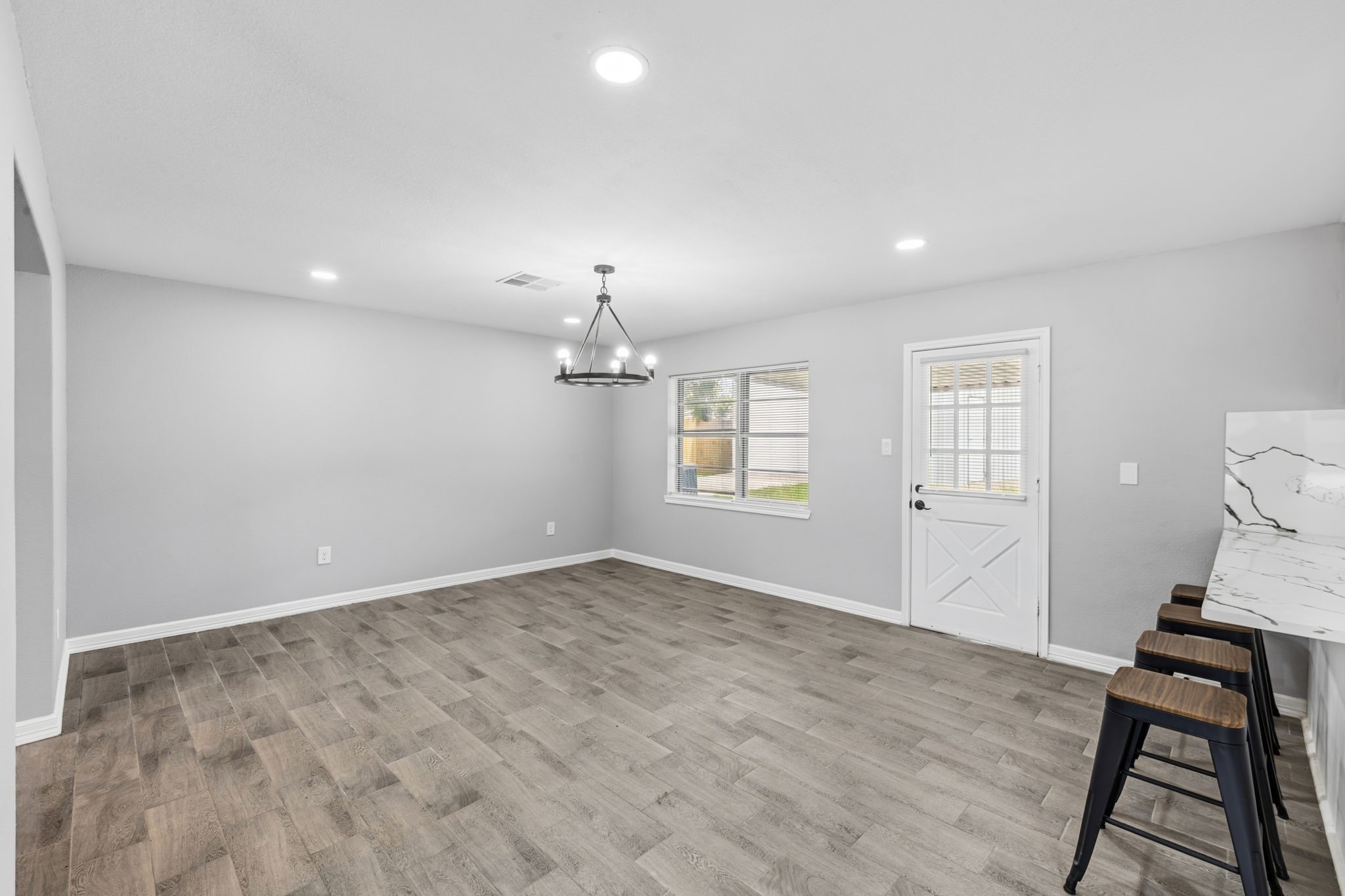 202 Massey Tompkins Road Baytown, TX 77521 - Photo 15 of 47 wooden floor in an empty room with a window
