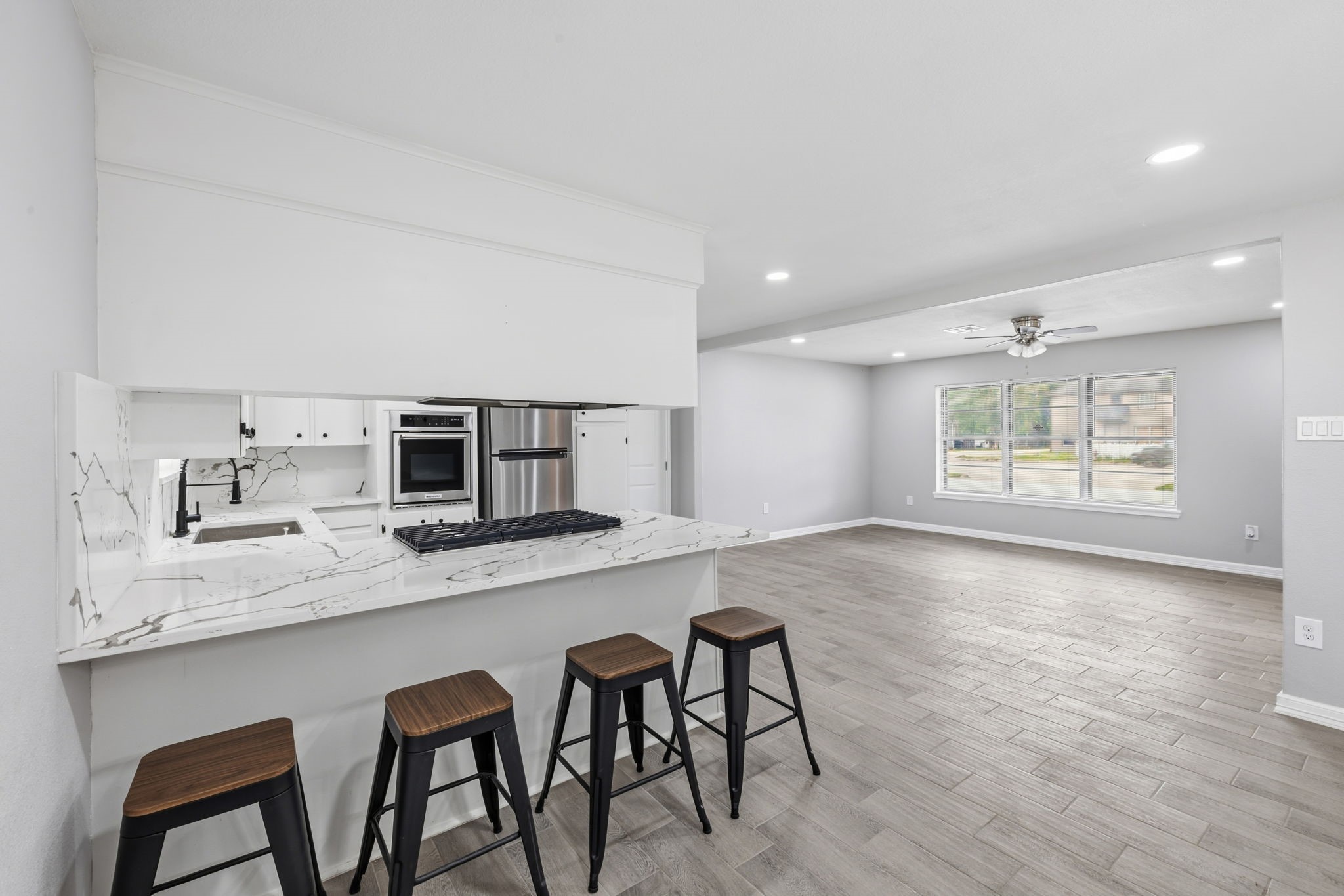 202 Massey Tompkins Road Baytown, TX 77521 - Photo 19 of 47 a large white kitchen with a table and chairs in it