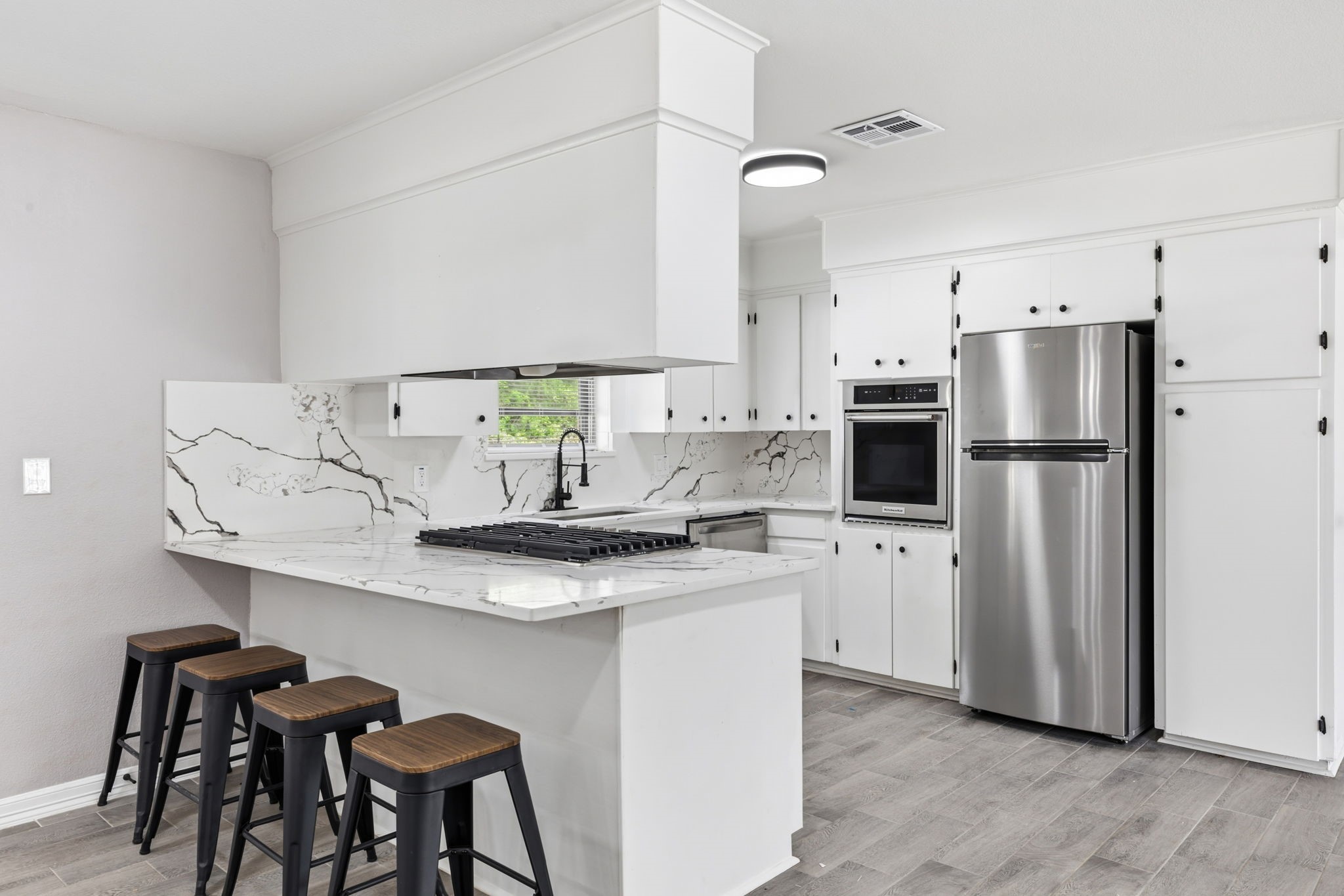 202 Massey Tompkins Road Baytown, TX 77521 - Photo 20 of 47 a kitchen with stainless steel appliances a sink and a refrigerator
