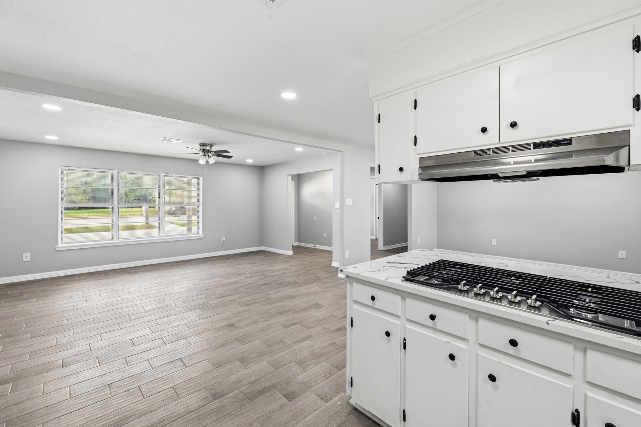 202 Massey Tompkins Road Baytown, TX 77521 - Photo 22 of 47 a kitchen with granite countertop a stove and a refrigerator