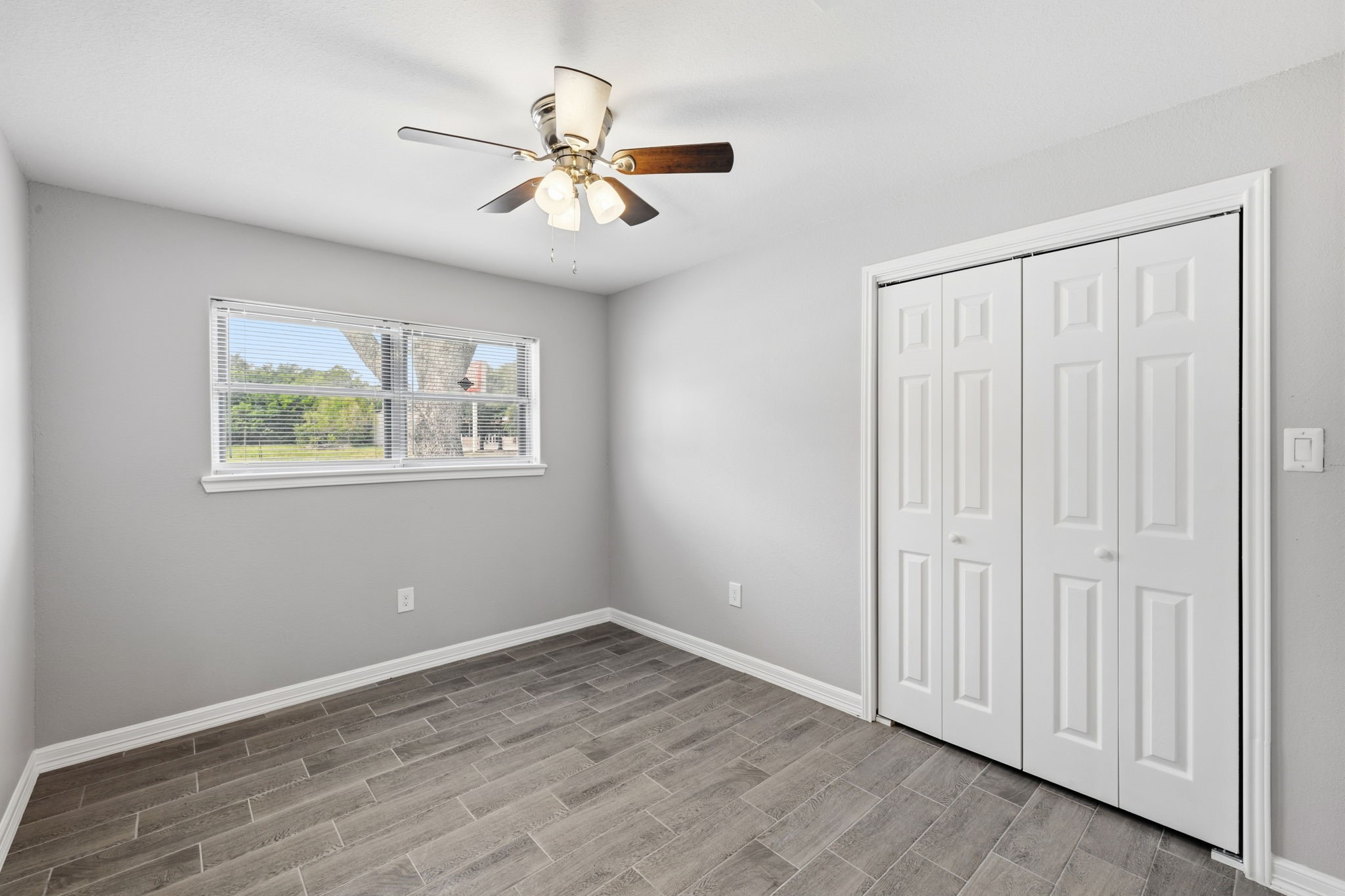 202 Massey Tompkins Road Baytown, TX 77521 - Photo 28 of 47 a view of an empty room with a window and wooden floor