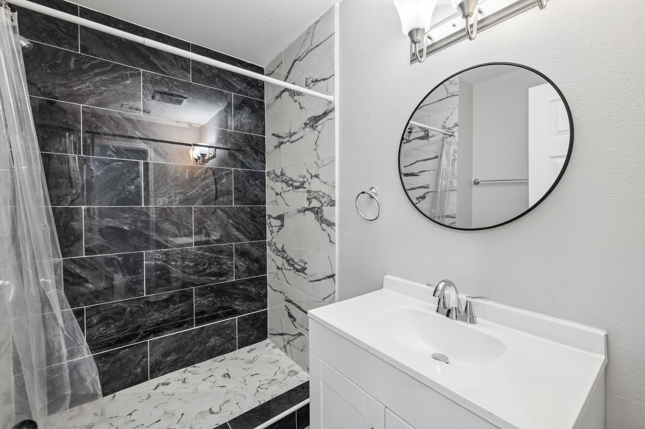 202 Massey Tompkins Road Baytown, TX 77521 - Photo 30 of 47 a bathroom with a sink and a mirror