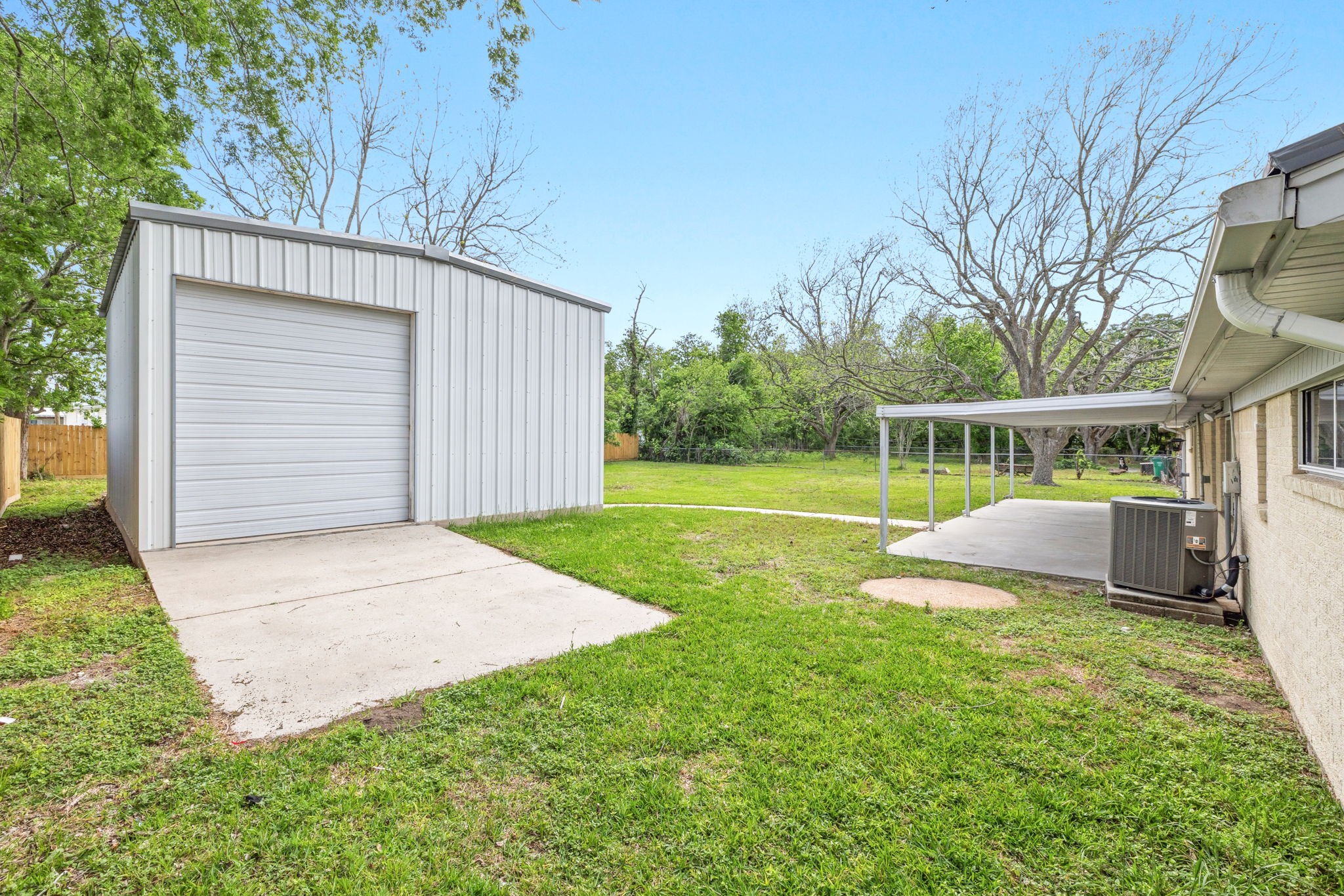 202 Massey Tompkins Road Baytown, TX 77521 - Photo 40 of 47 a view of a backyard with a small cabin