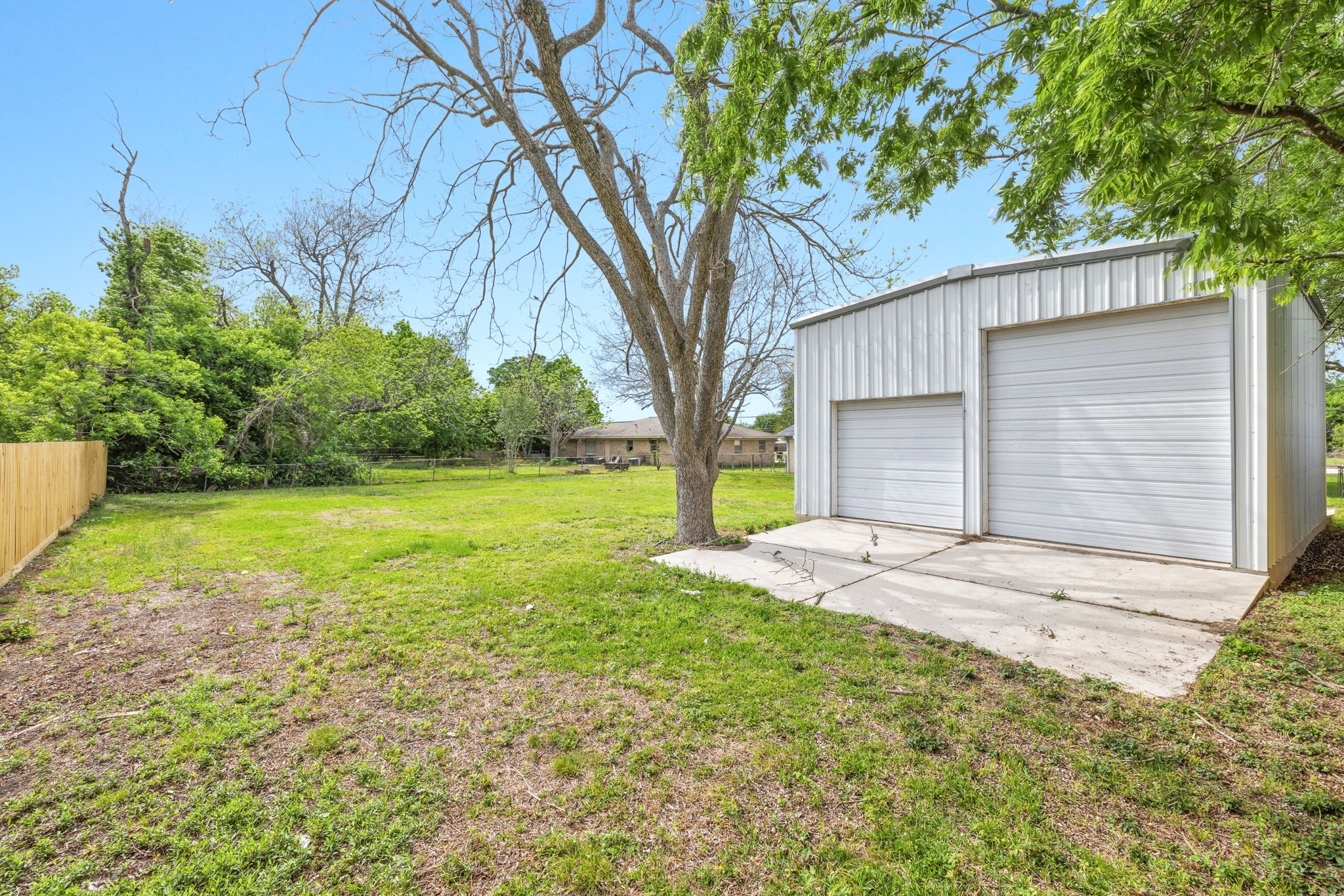 202 Massey Tompkins Road Baytown, TX 77521 - Photo 42 of 47 a view of a backyard with large trees