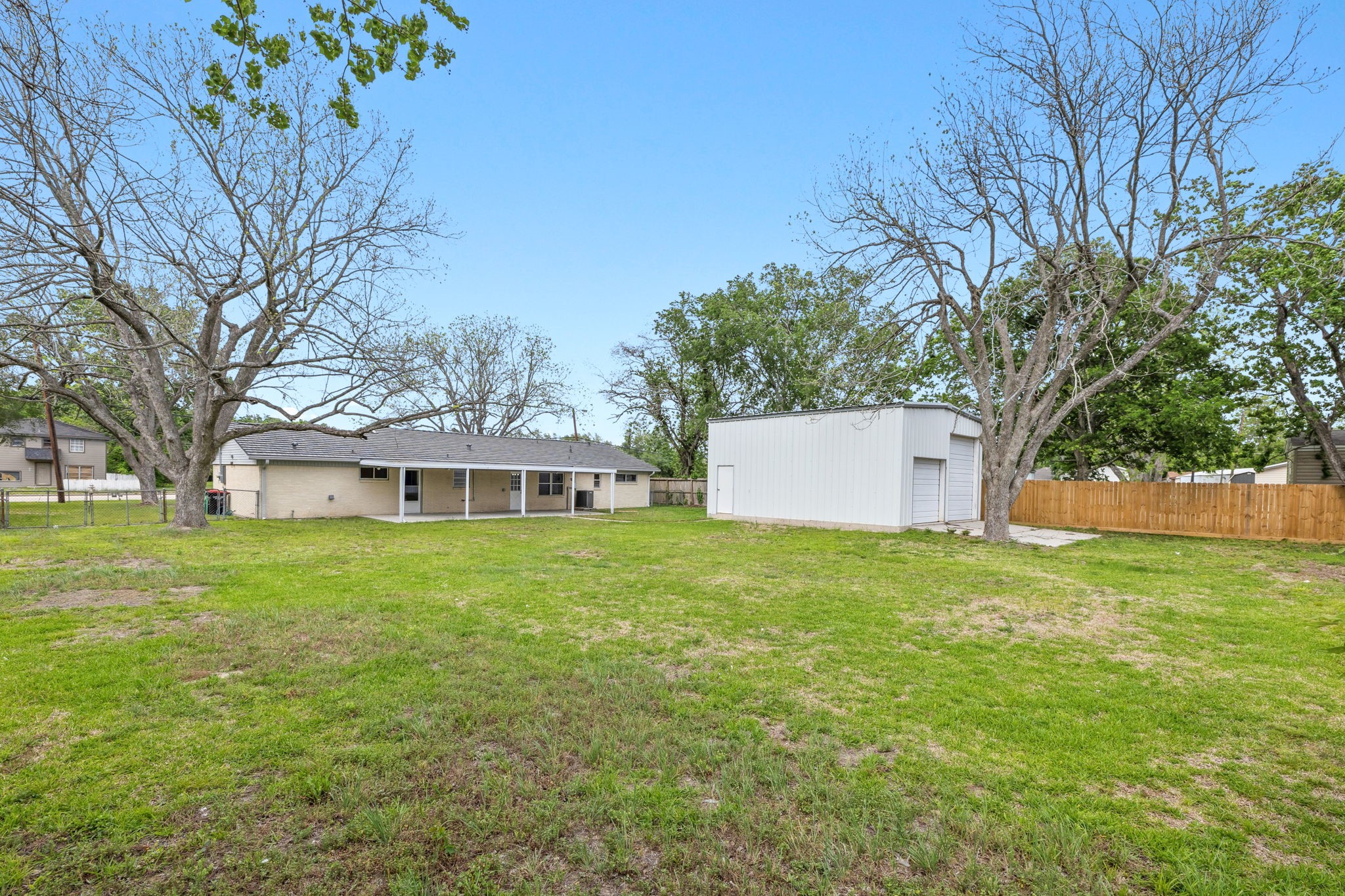 202 Massey Tompkins Road Baytown, TX 77521 - Photo 44 of 47 front view of a house with a yard