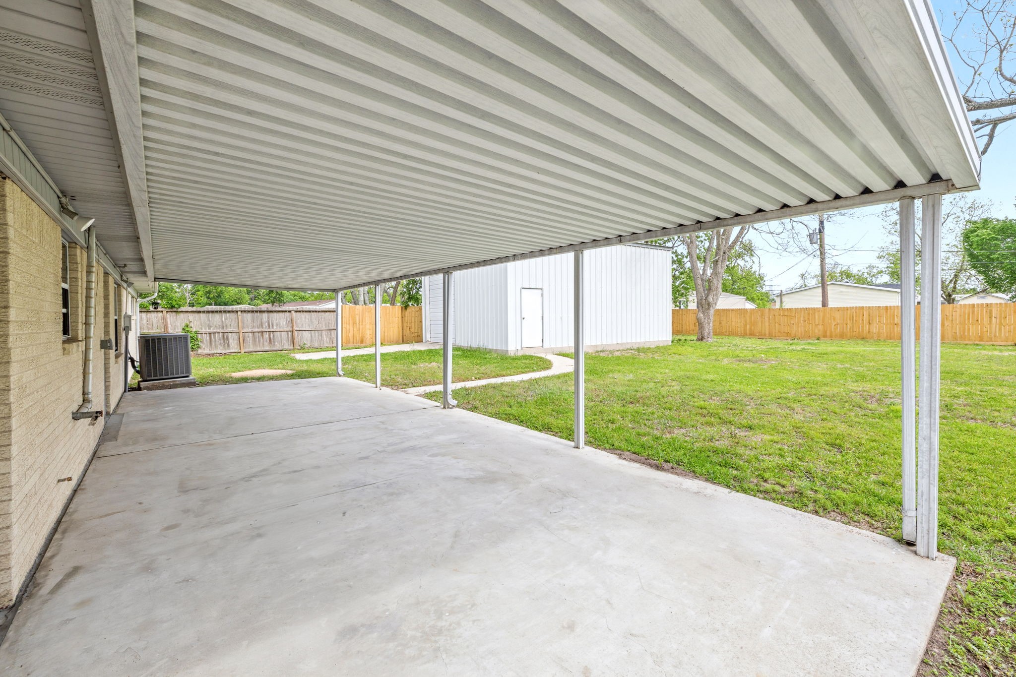 202 Massey Tompkins Road Baytown, TX 77521 - Photo 46 of 47 a view of a house with backyard and porch