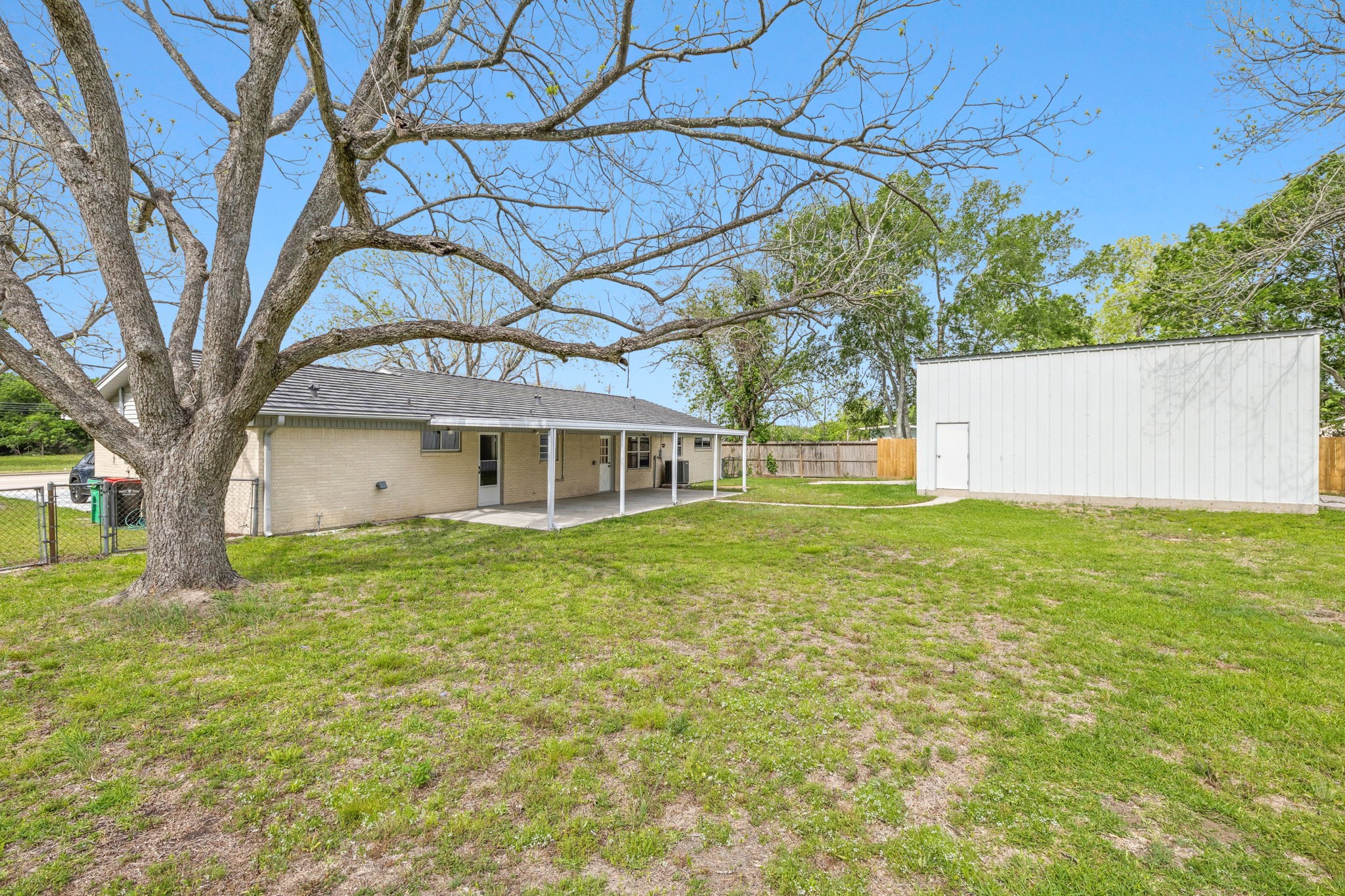 202 Massey Tompkins Road Baytown, TX 77521 - Photo 47 of 47 a front view of a house with a garden