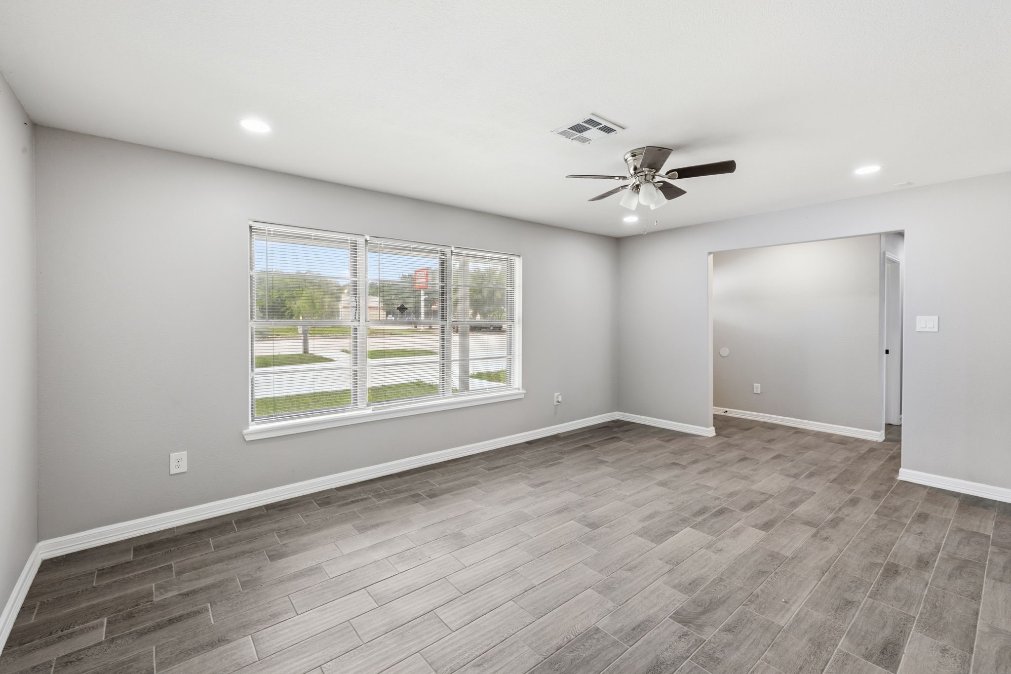 202 Massey Tompkins Road Baytown, TX 77521 - Photo 9 of 47 an empty room with fan and windows