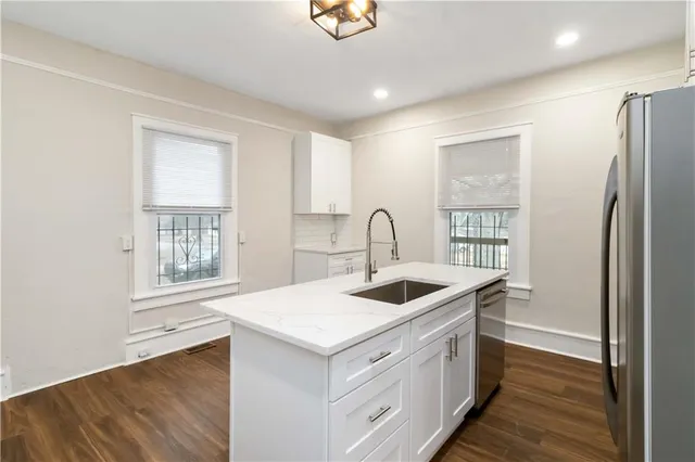 a kitchen with a stove and a refrigerator