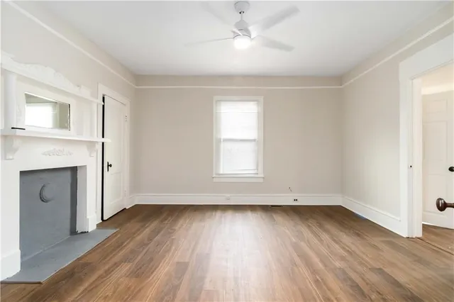 wooden floor in an empty room with a window