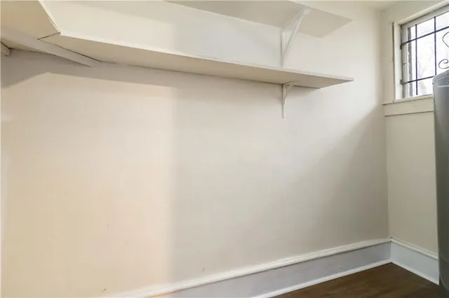 a view of a small space with racks on the wall